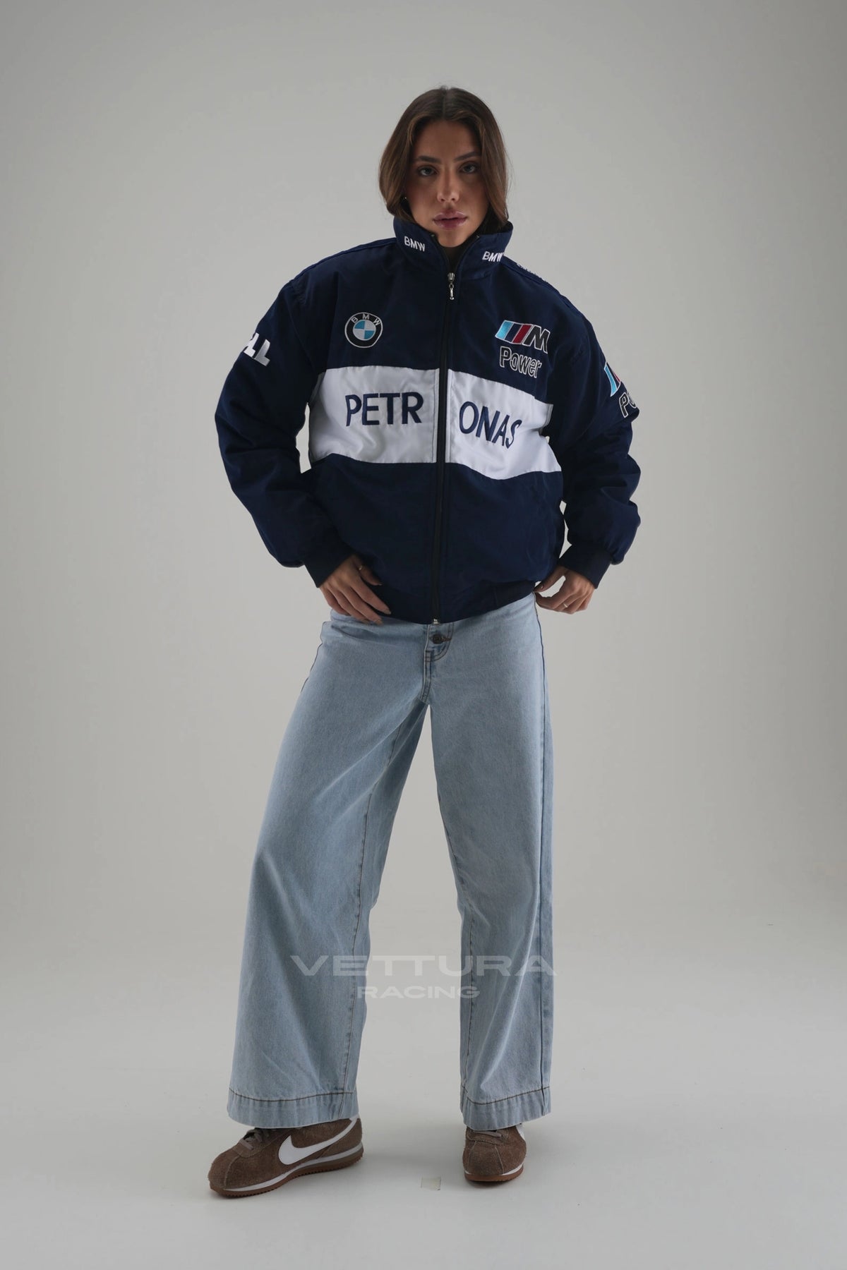 Woman wearing the navy BMW M Power Petronas vintage racing jacket