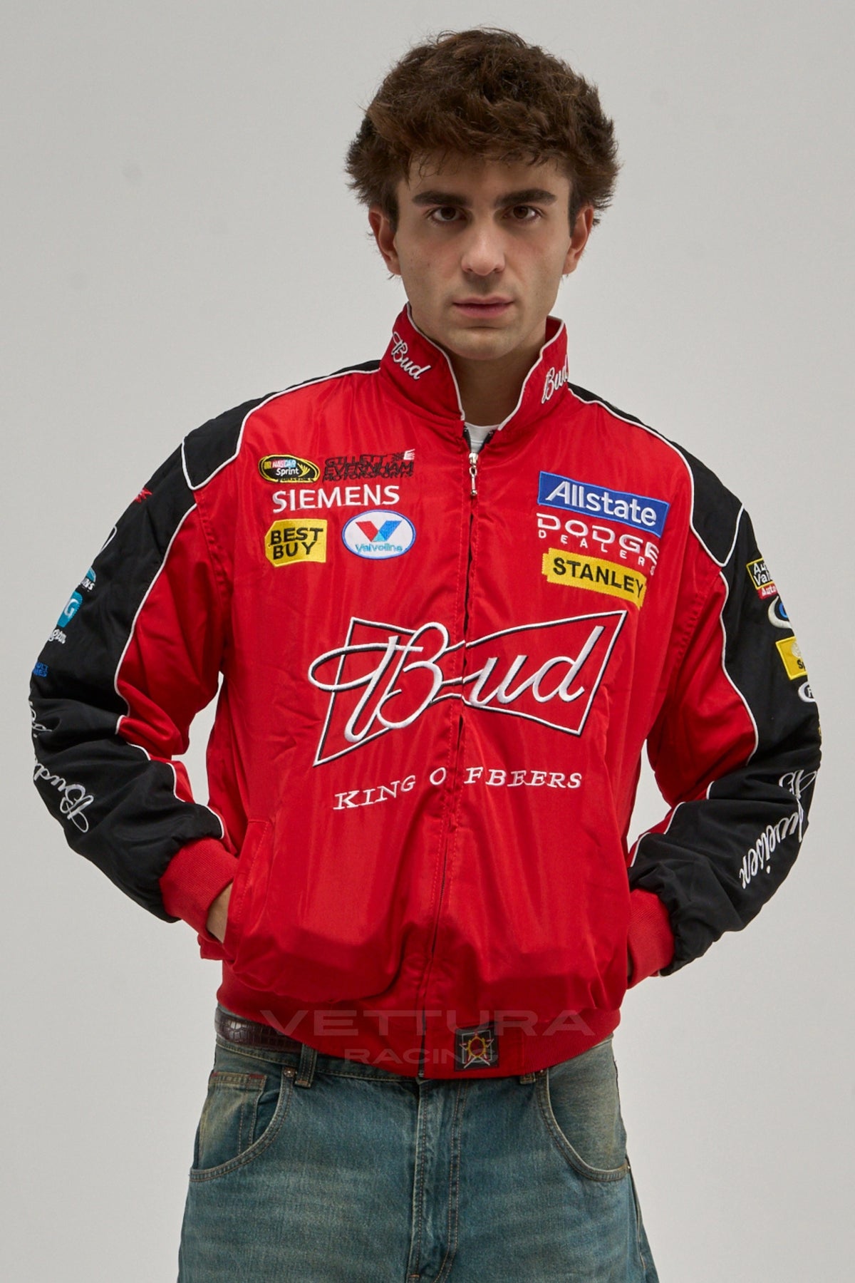 Model wearing the red and black Budweiser NASCAR vintage racing jacket, front view