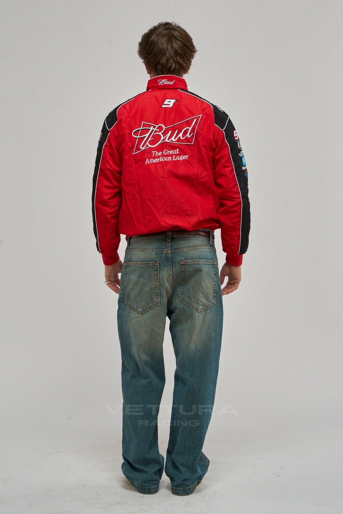 Back of the red Budweiser NASCAR vintage racing jacket on a model