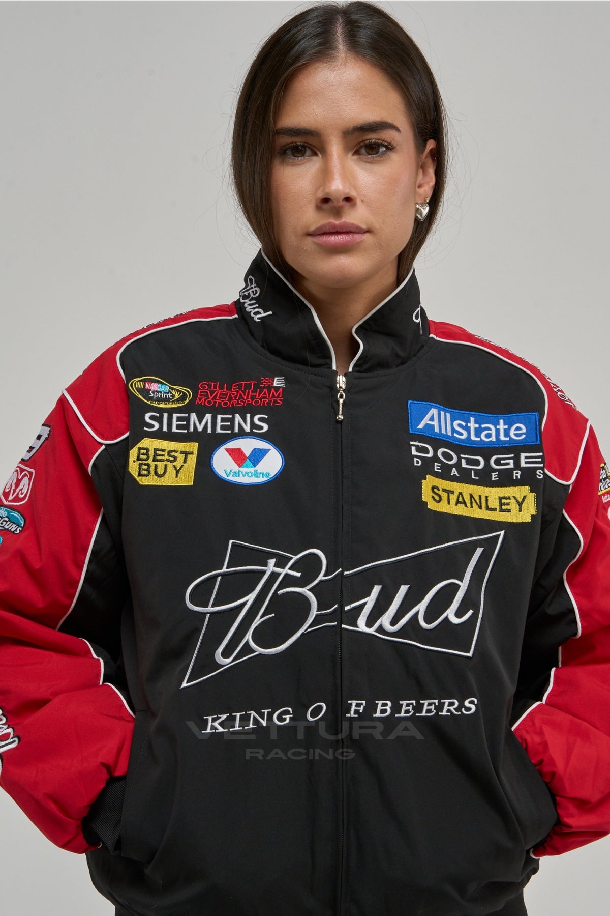 Woman wearing the black and red Budweiser NASCAR vintage racing jacket