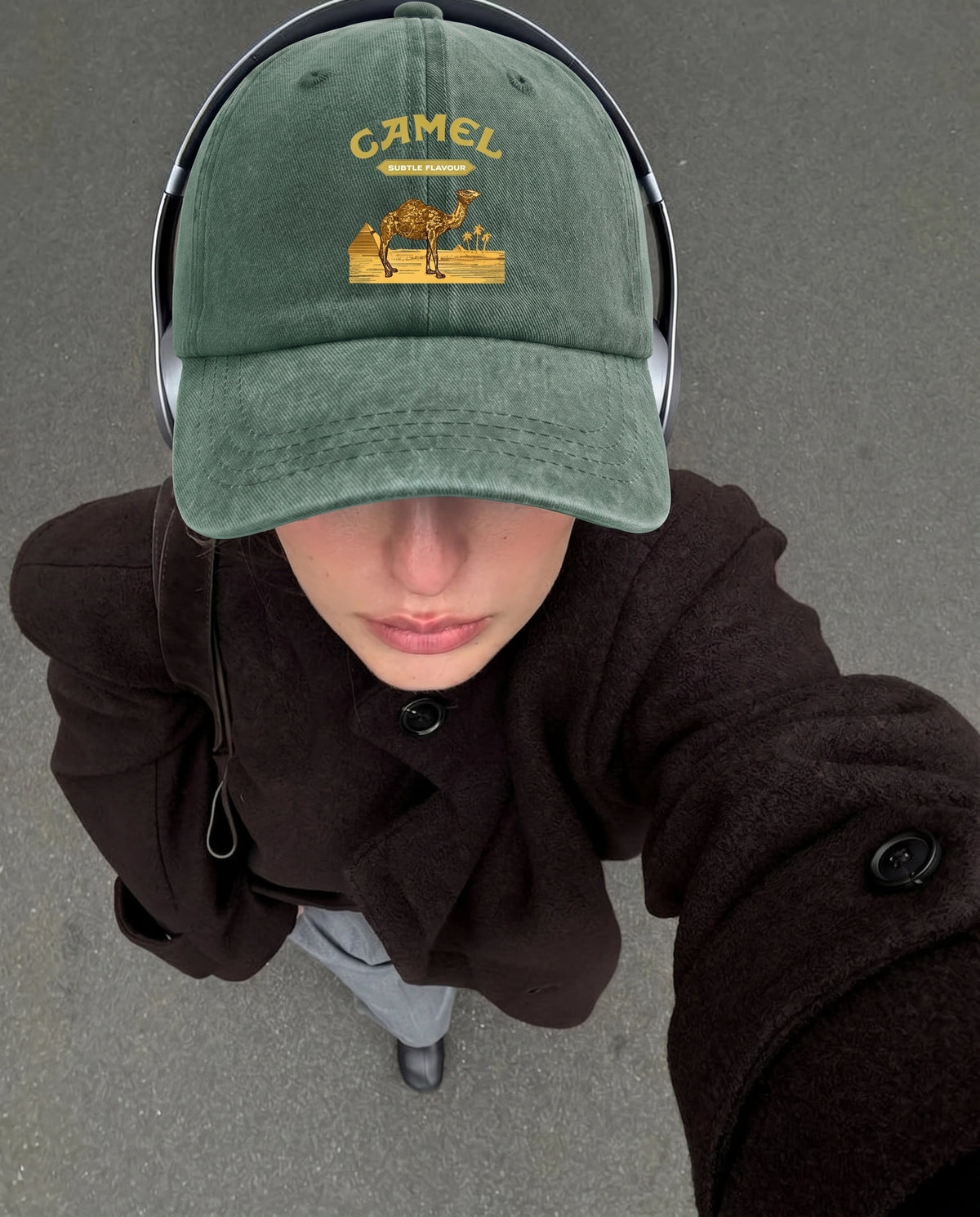 Green Camel Desert cap worn with a hoodie