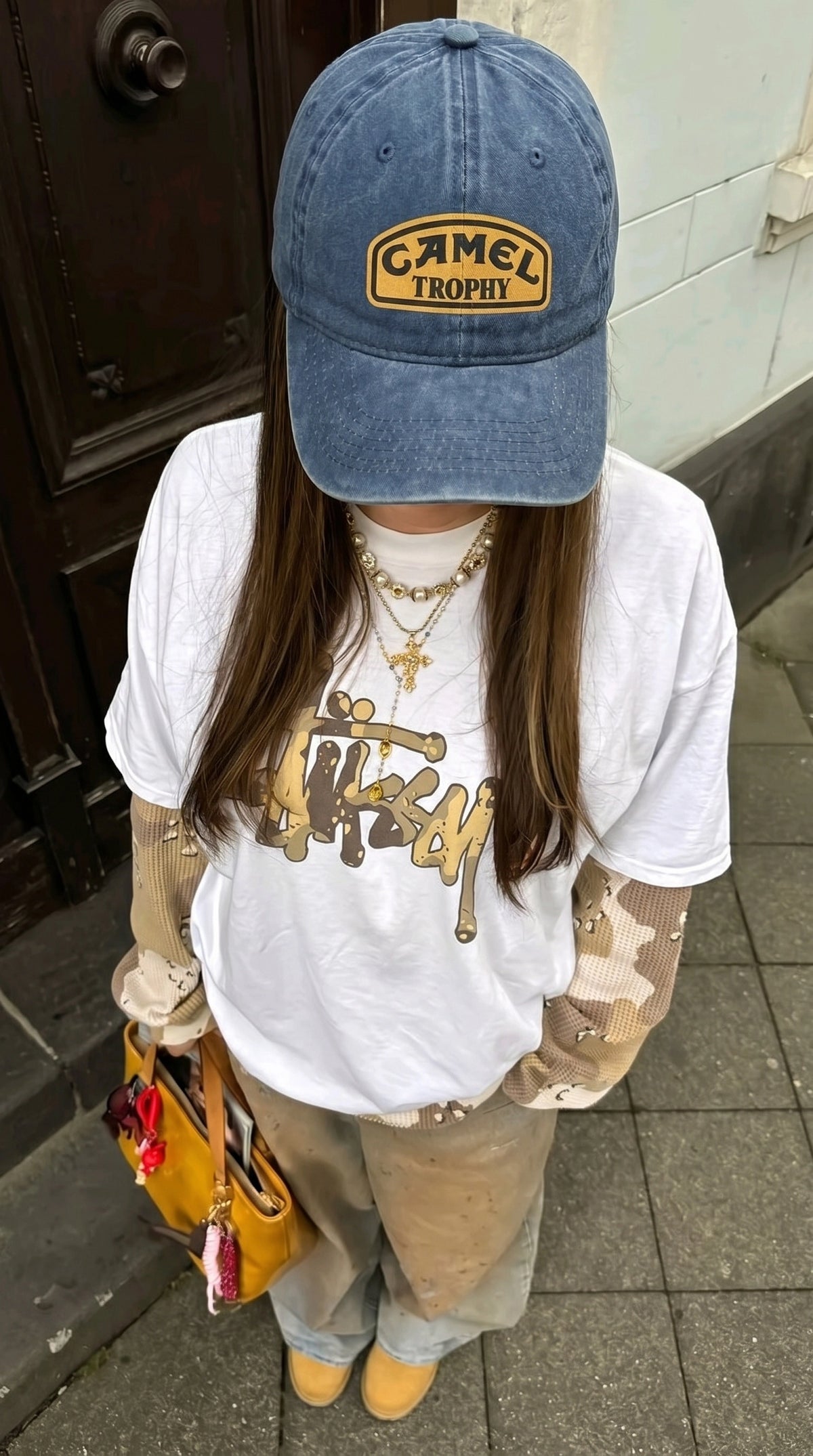 Camel Trophy cap worn with a light outfit