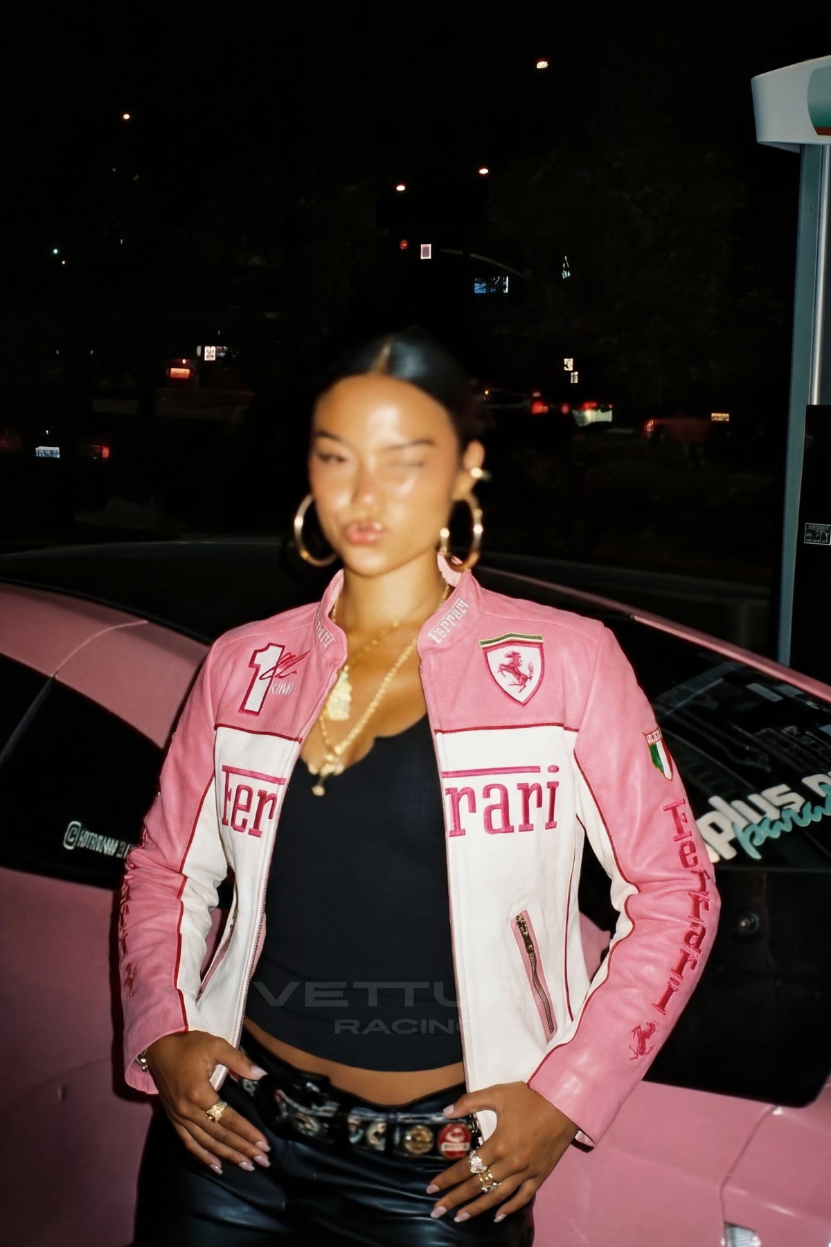 Close view of the Prancing Horse crest on the pink leather jacket