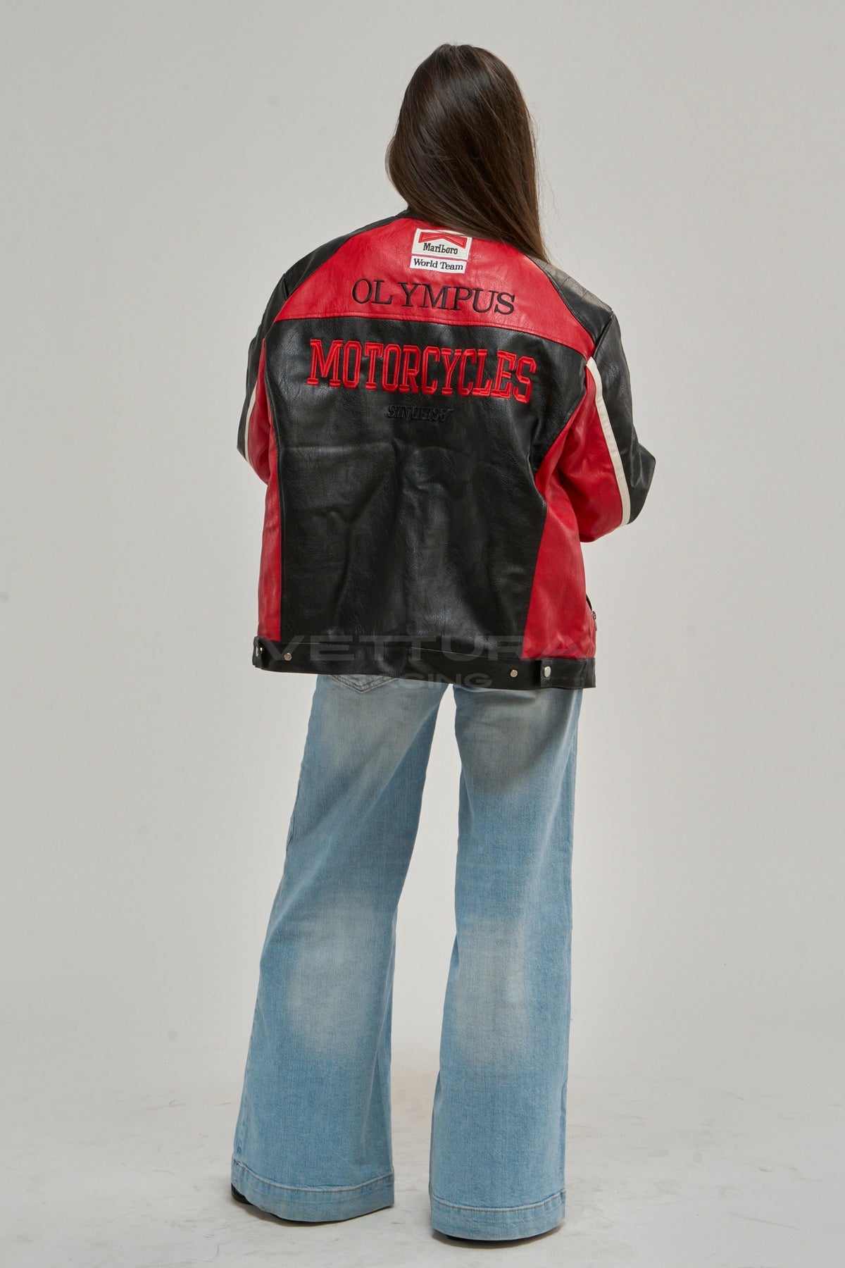 Ferrari F1 Olympus leather jacket in black and red worn with jeans, side view