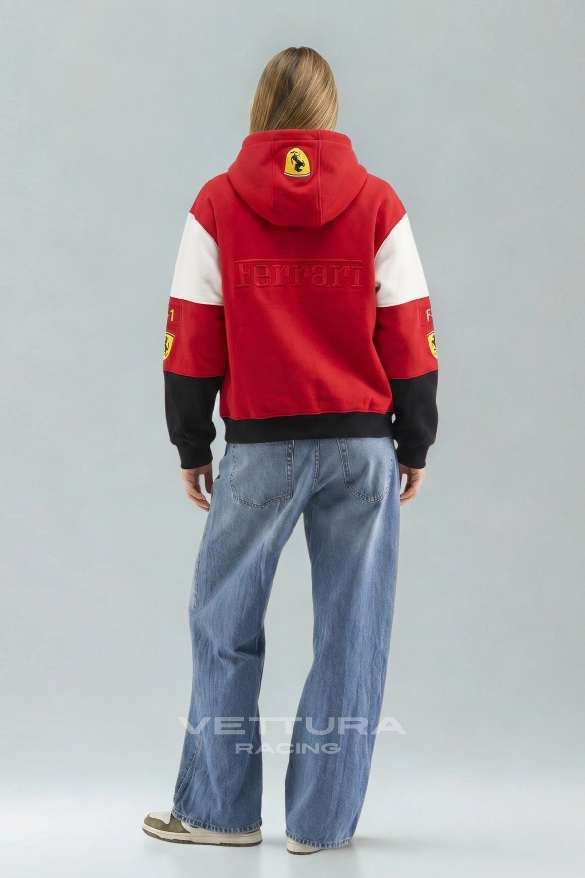 Model wearing the Ferrari F1 racing embroidered hoodie, front view