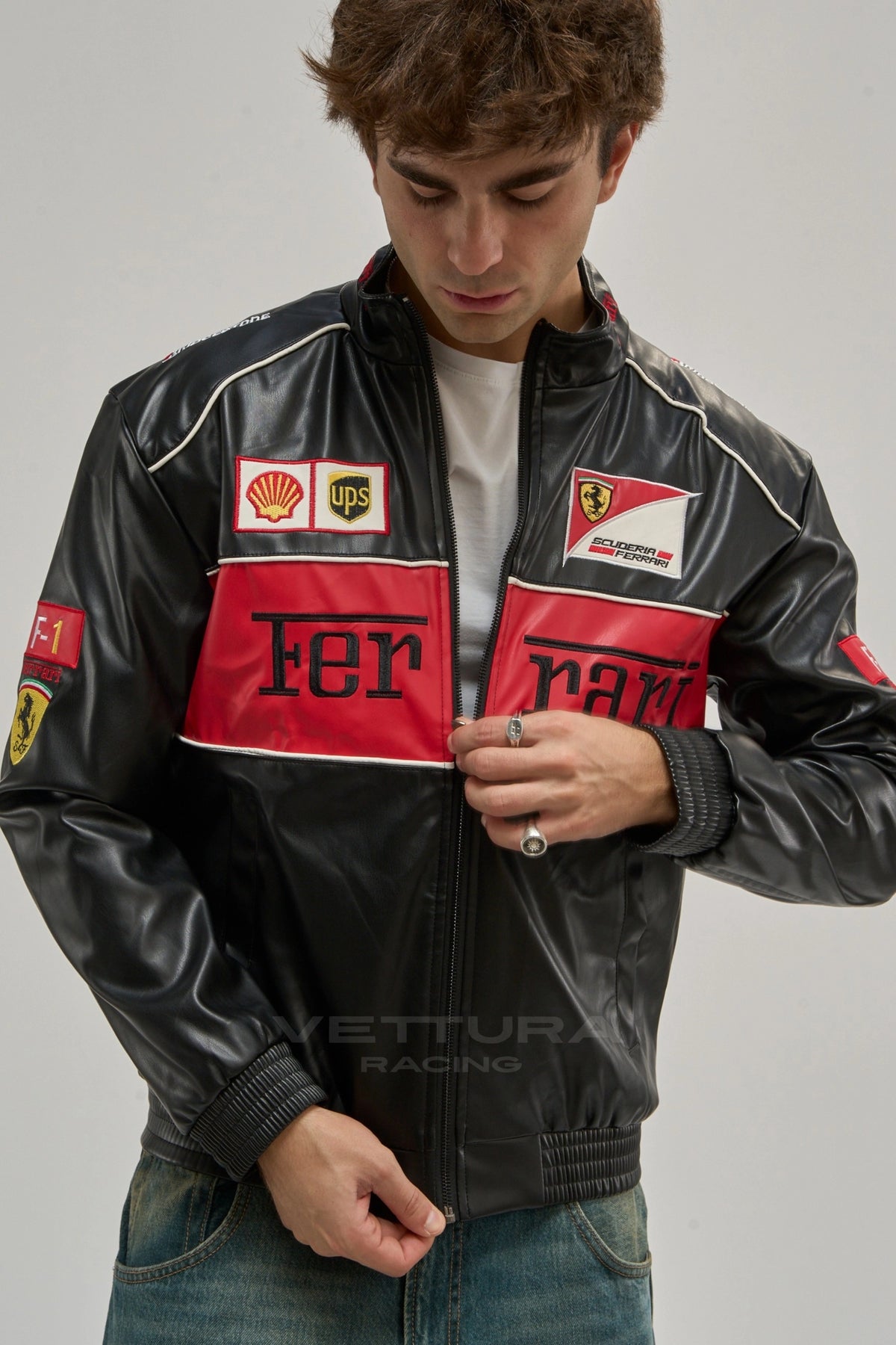 Ferrari F1 red vintage leather racing jacket worn on the street, glossy black shell