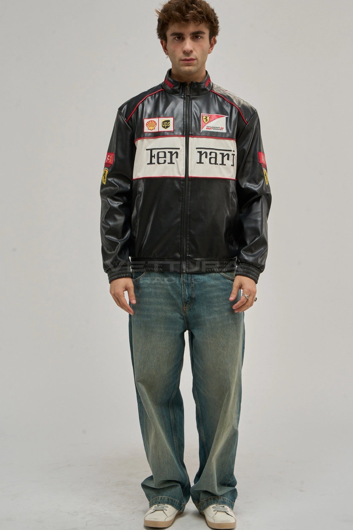 Model wearing the Ferrari F1 white edition vegan leather racing jacket, front view