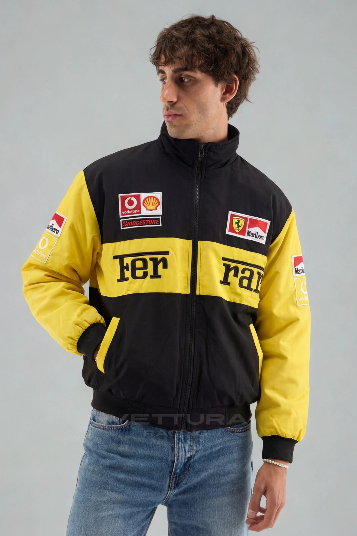 Model wearing the Ferrari F1 Michael Schumacher vintage racing jacket, front view