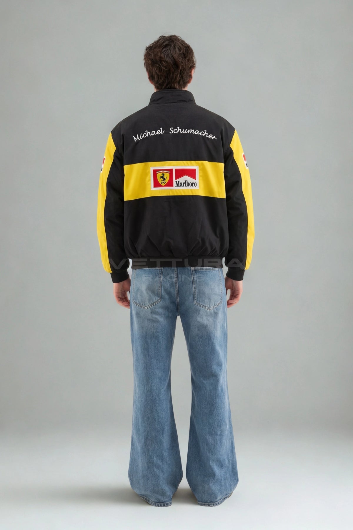 Ferrari F1 Michael Schumacher racing jacket in black and yellow worn on a model