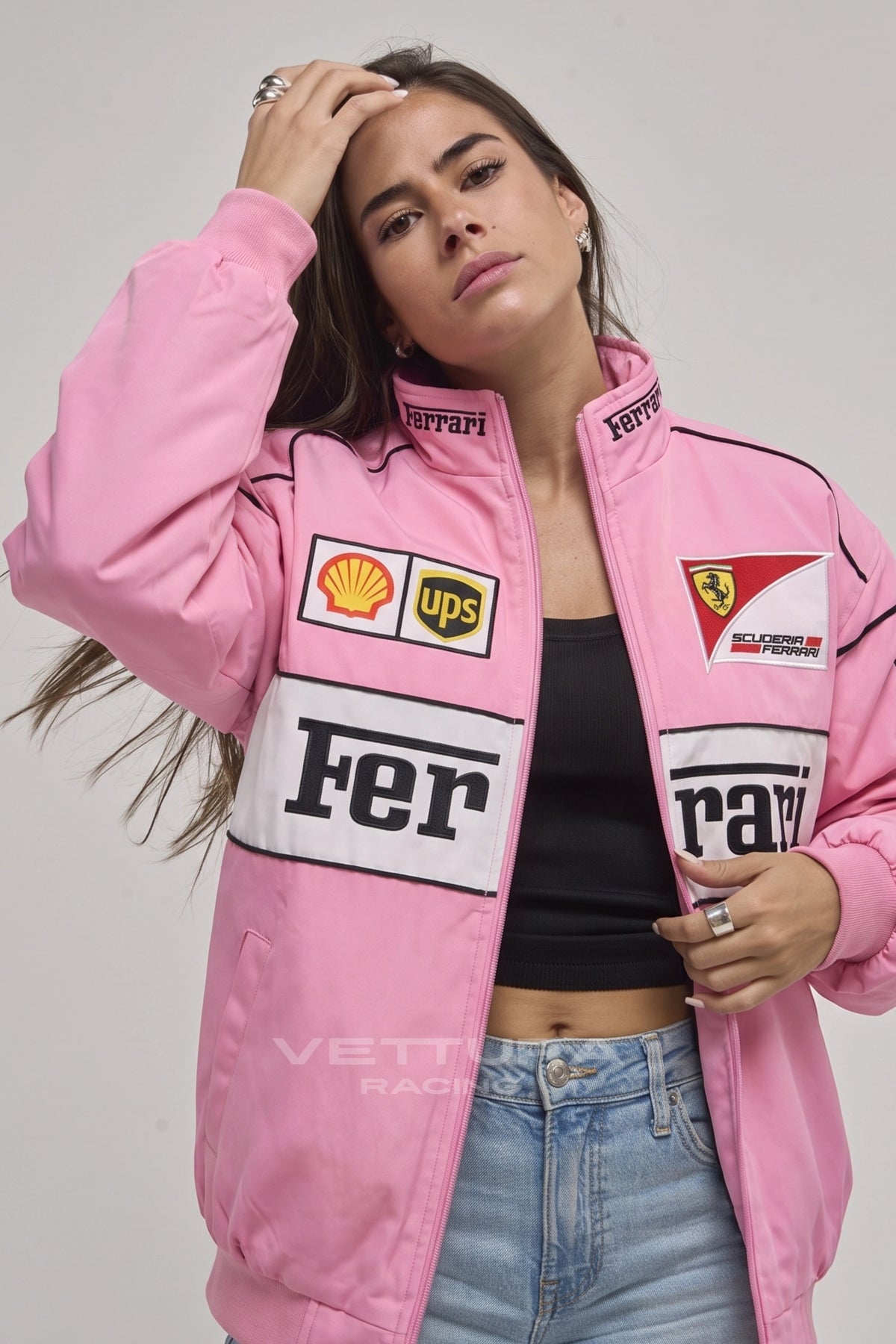 Model wearing the Ferrari F1 pink vintage racing jacket, front view