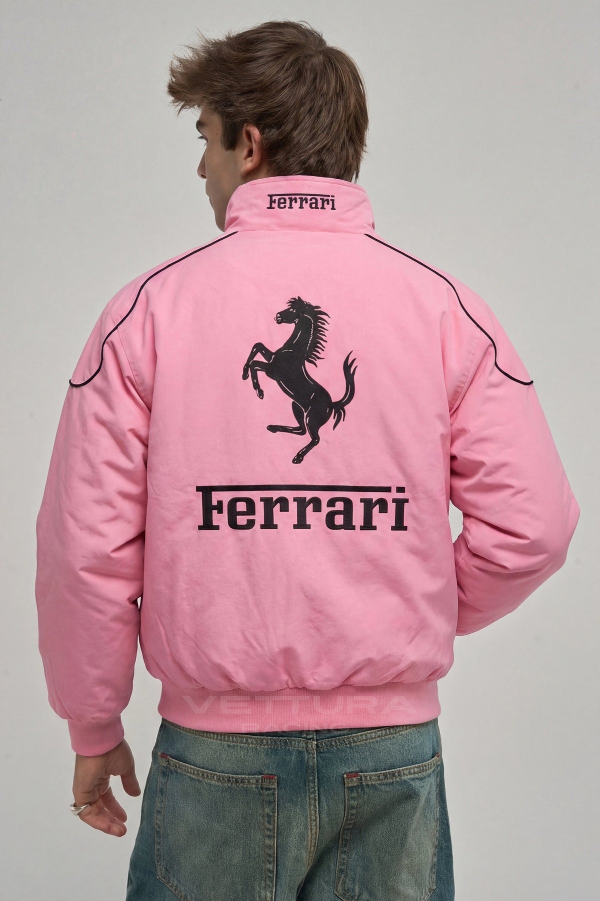 Ferrari F1 pink racing jacket styled with jeans in daylight