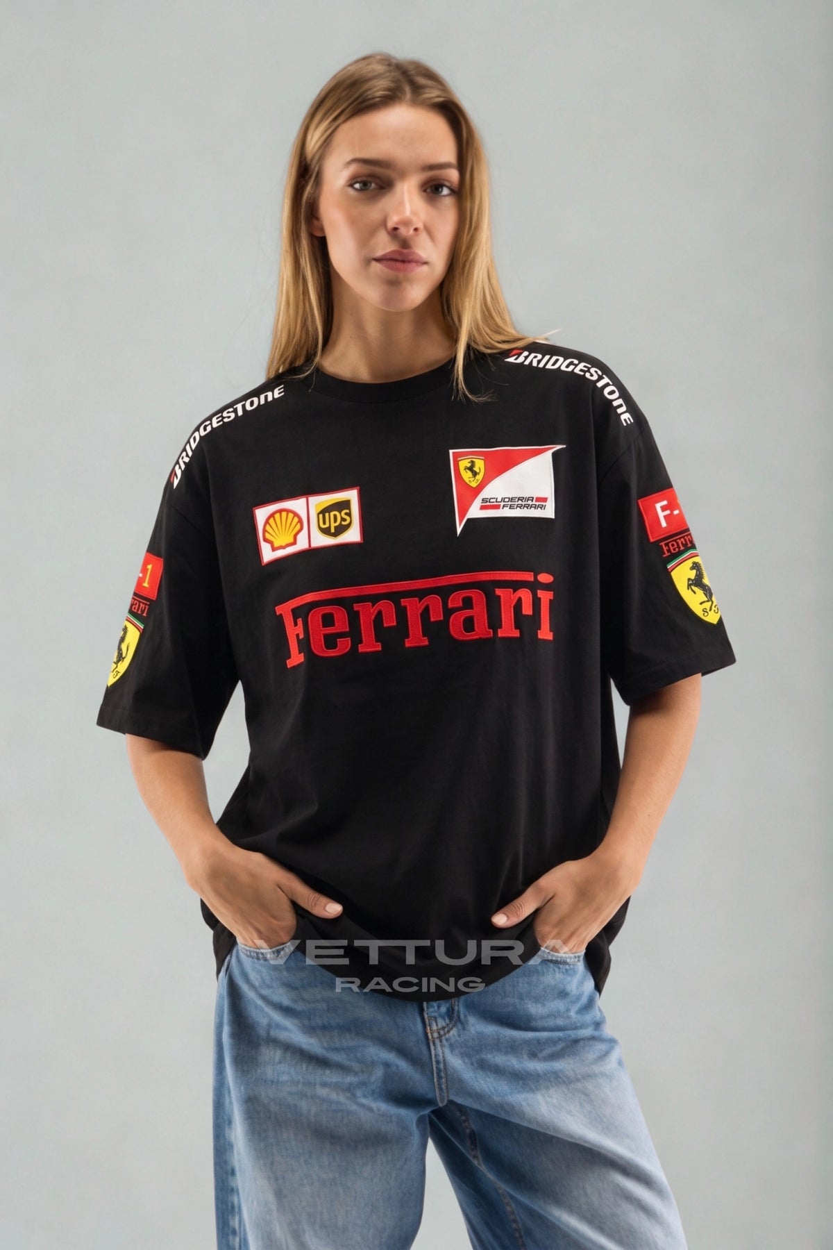 Model wearing the Ferrari F1 vintage racing t-shirt in black, front view