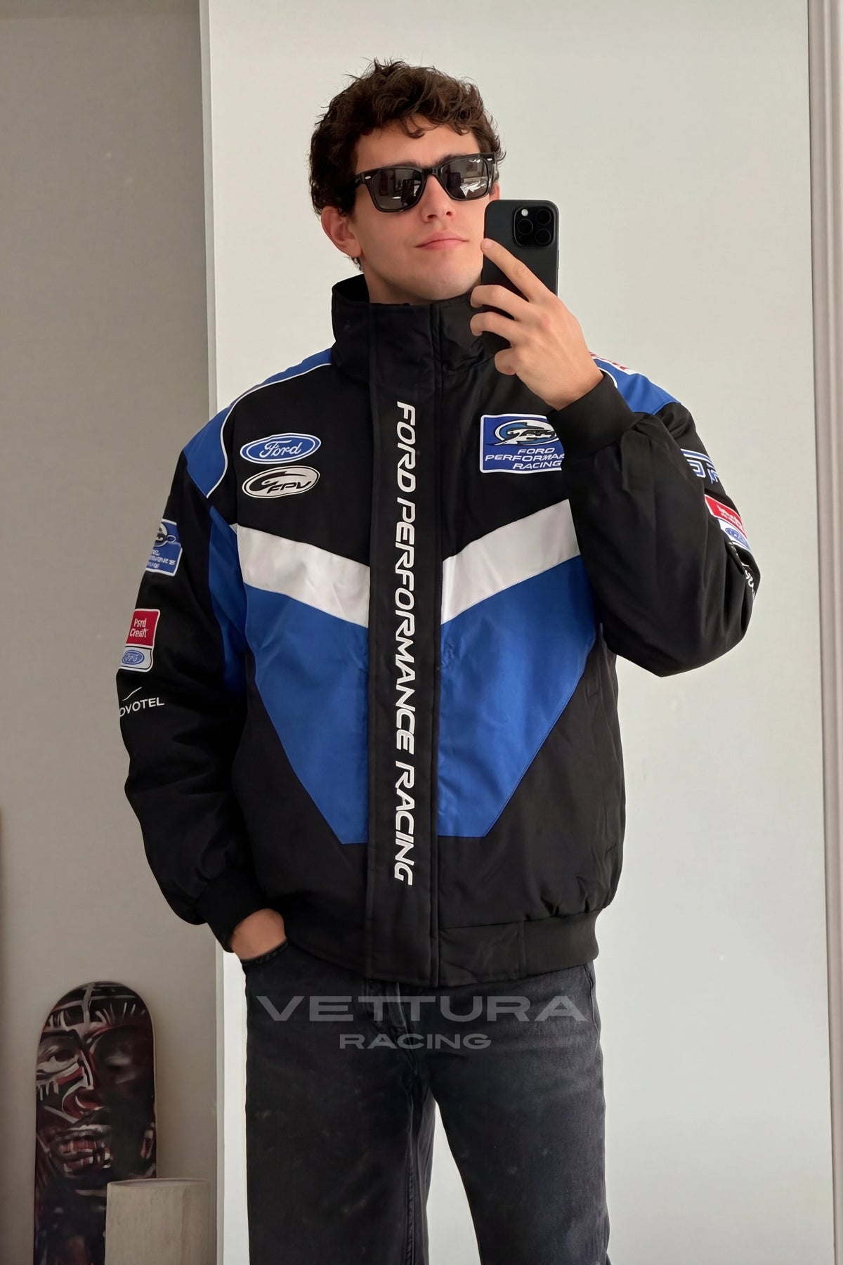 Outdoor lifestyle shot of the Ford Performance Racing vintage bomber jacket