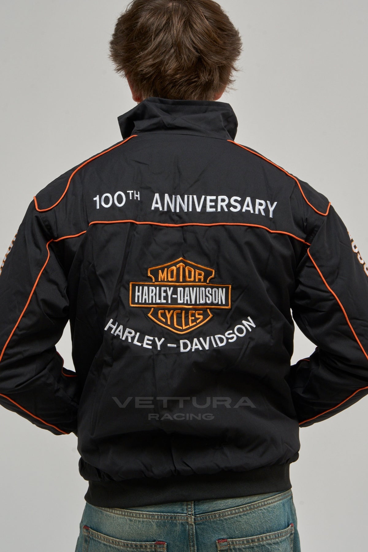 Back of the black Harley Davidson vintage jacket on a model