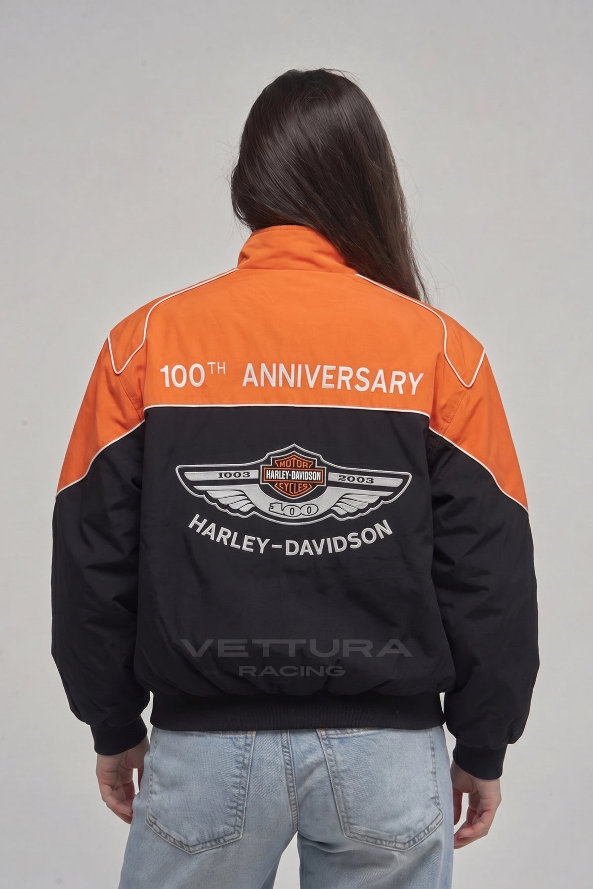 Model wearing the Harley Davidson orange vintage jacket, front view