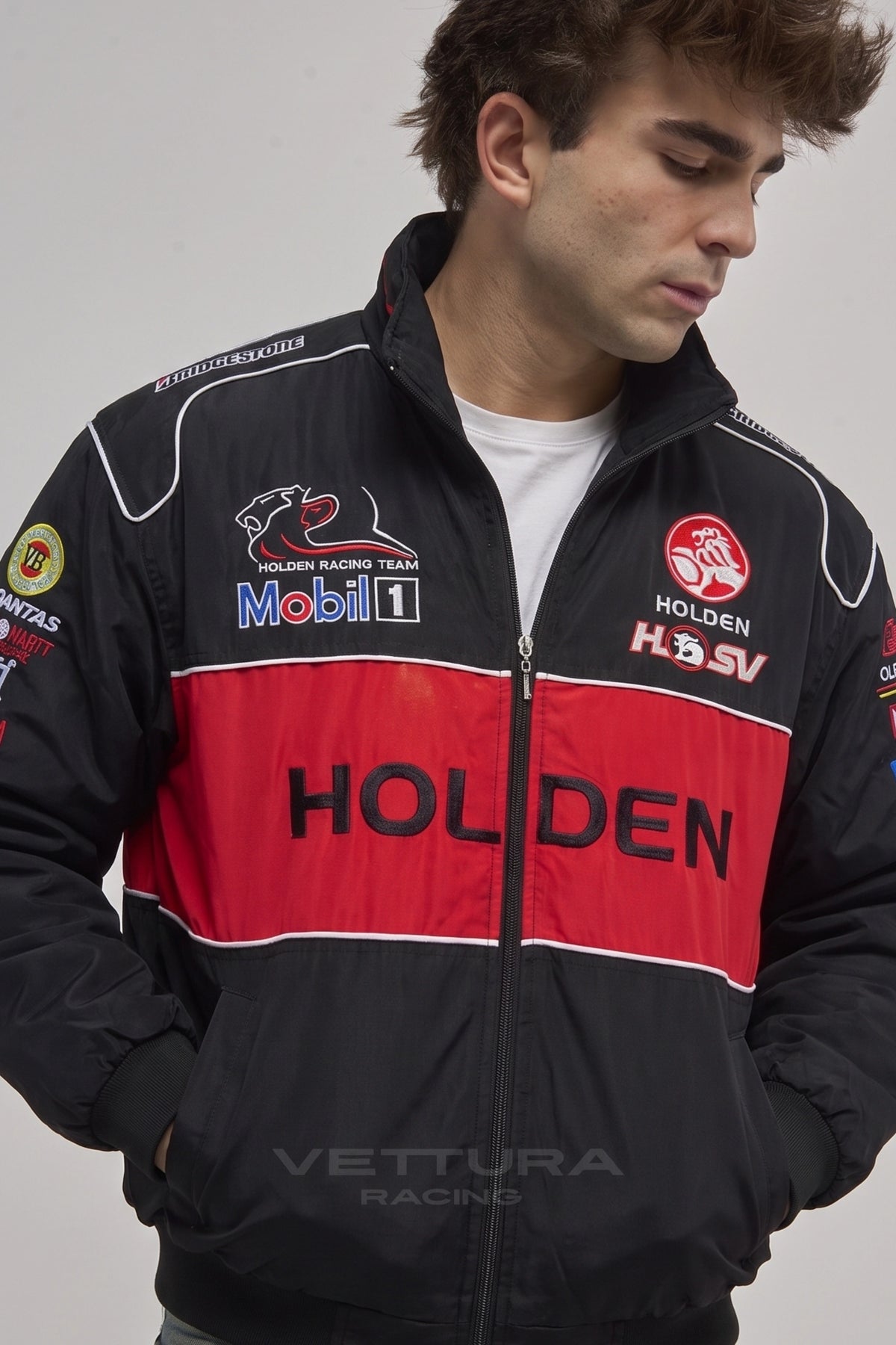 Model wearing the Holden vintage racing jacket in black and red, front view