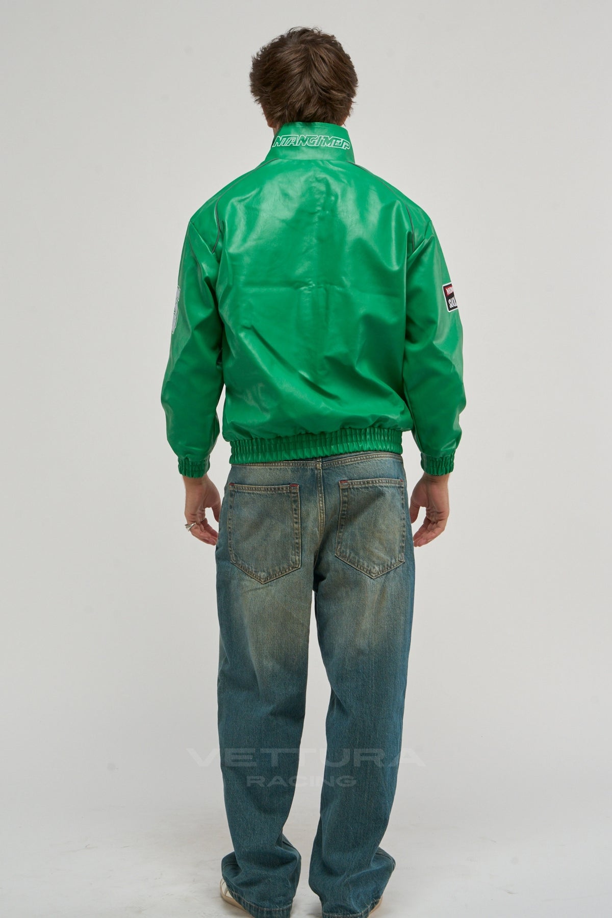 Model wearing the LAP 85 green racing bomber jacket, front view