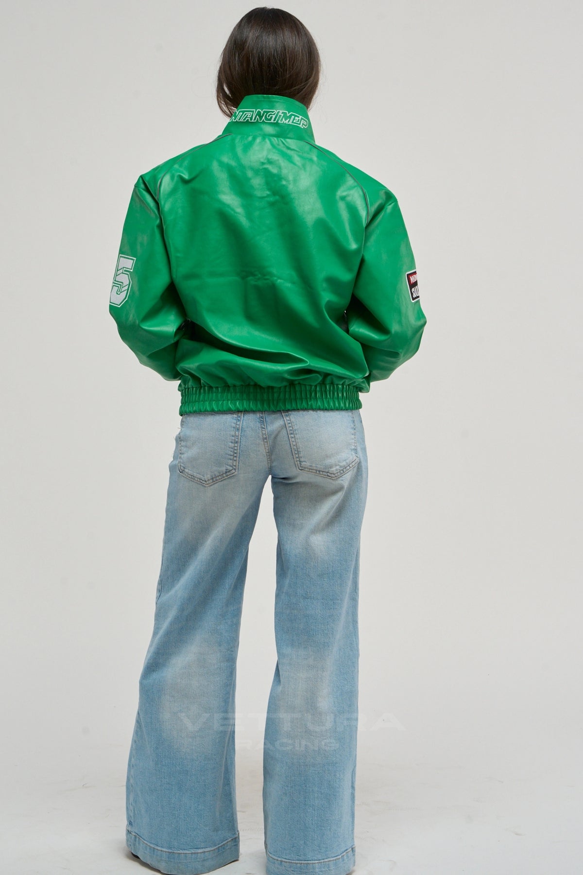 LAP 85 green racing jacket on a model, sleeve patch detail