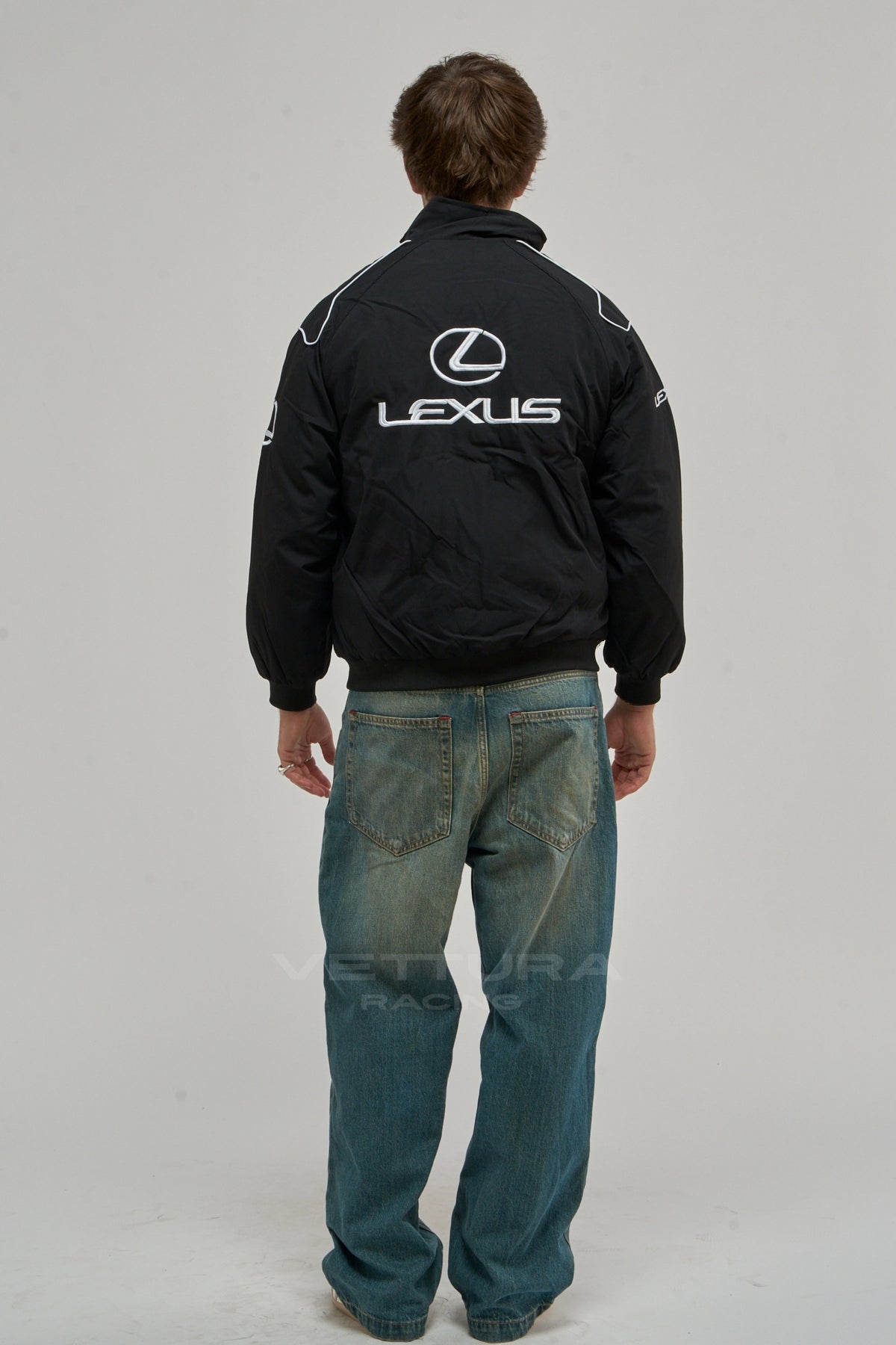 Back of the black Lexus vintage racing jacket on a model