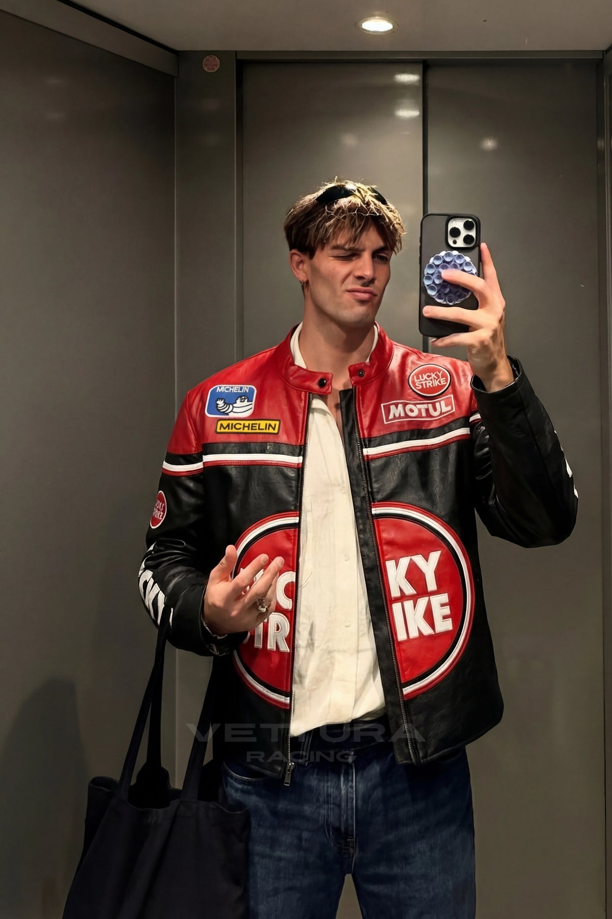 Close view of the red Lucky Strike roundel on the leather jacket