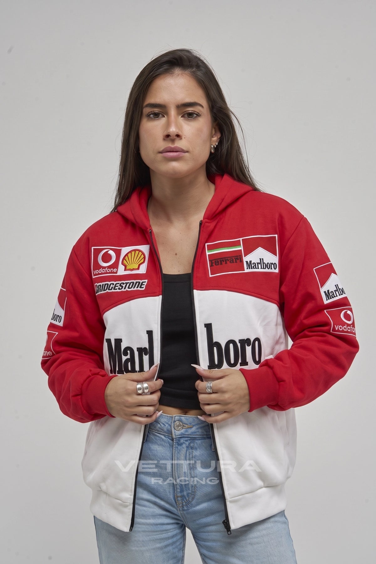 Model wearing the Marlboro Ferrari embroidered zip hoodie in red and white, front view