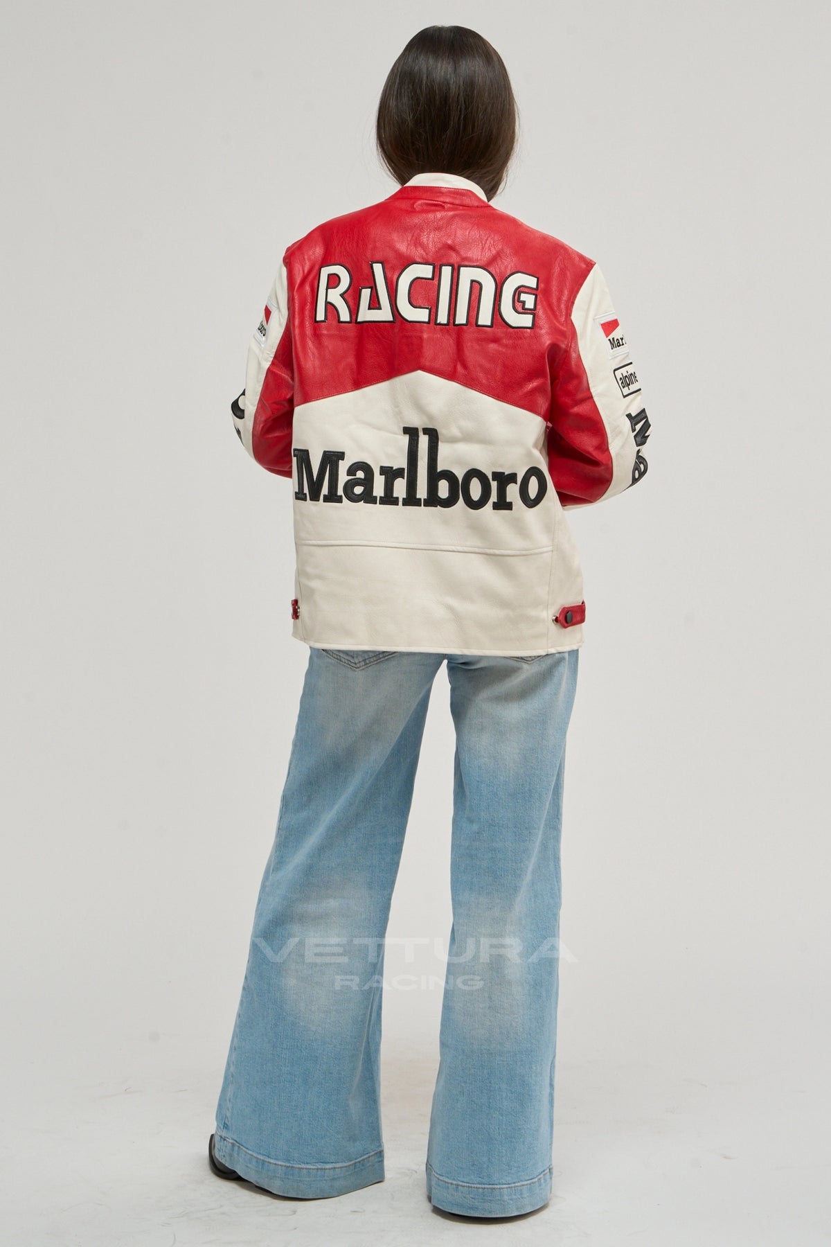 Rear view of the Marlboro racing leather jacket worn with wide leg jeans