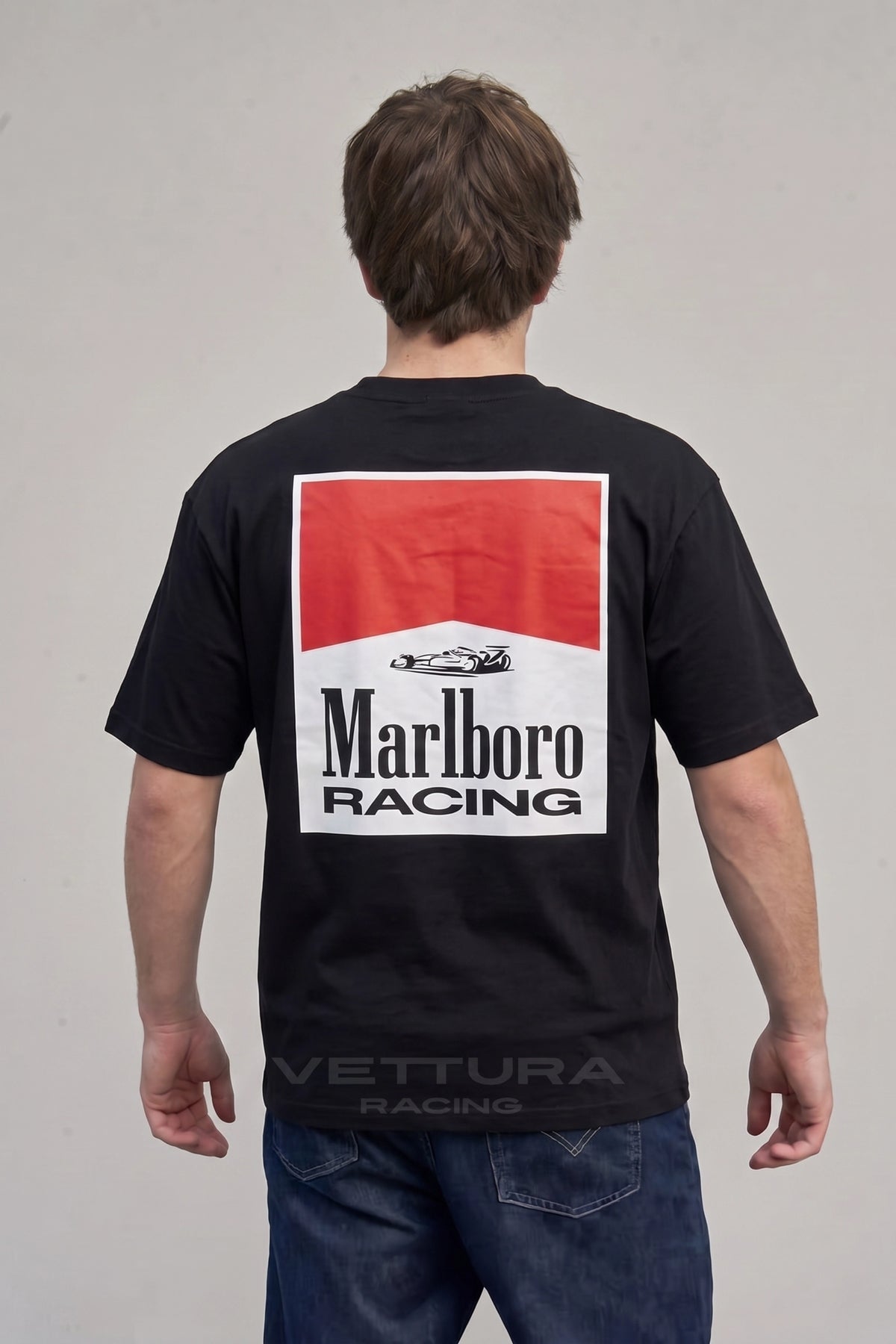 Close view of the Marlboro Racing chest badge on the black tee