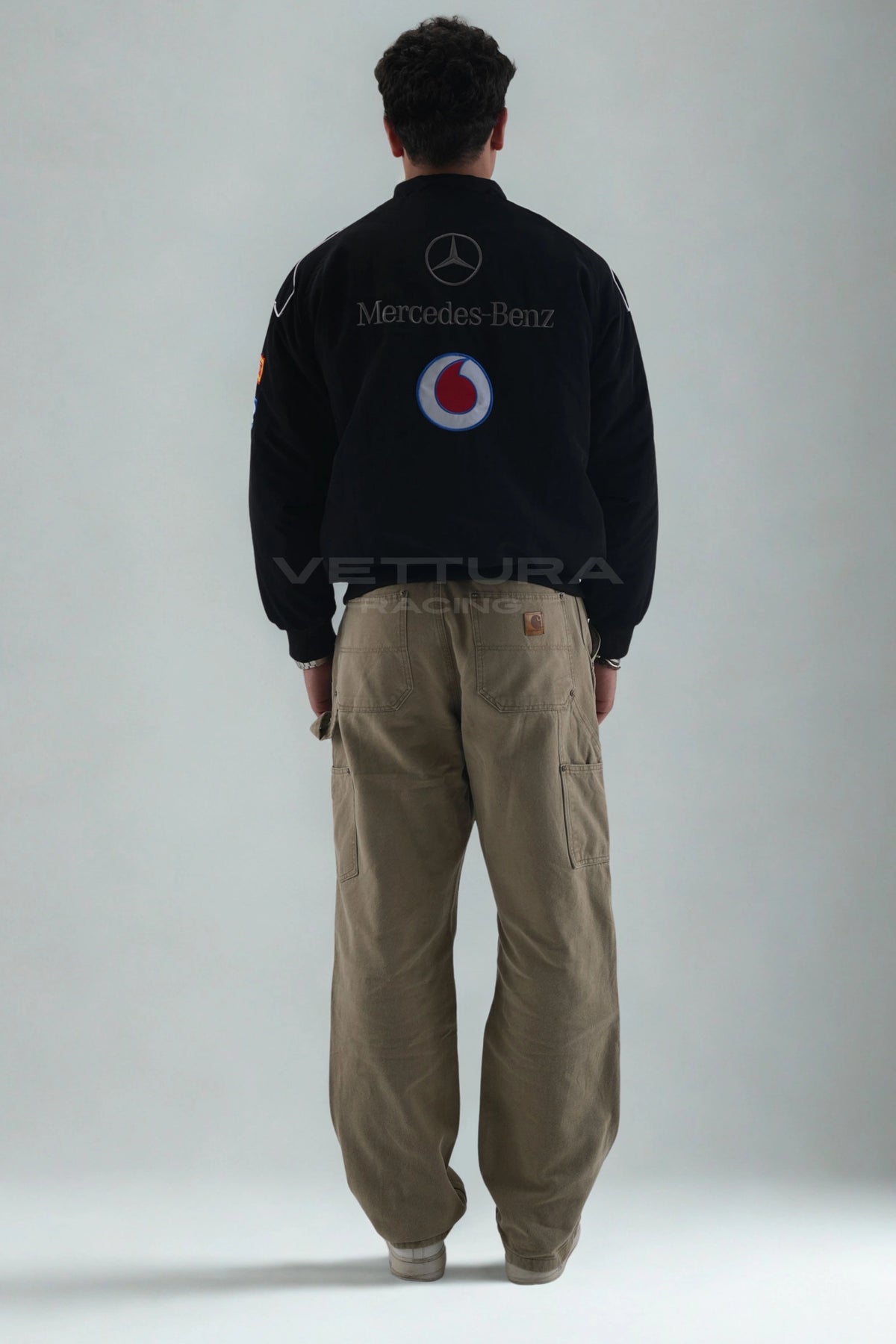 Back of the black Mercedes-Benz Santander F1 jacket showing the embroidered star