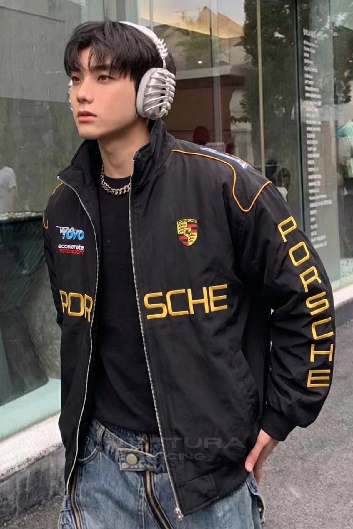Outdoor lifestyle shot of the Porsche vintage racing bomber jacket