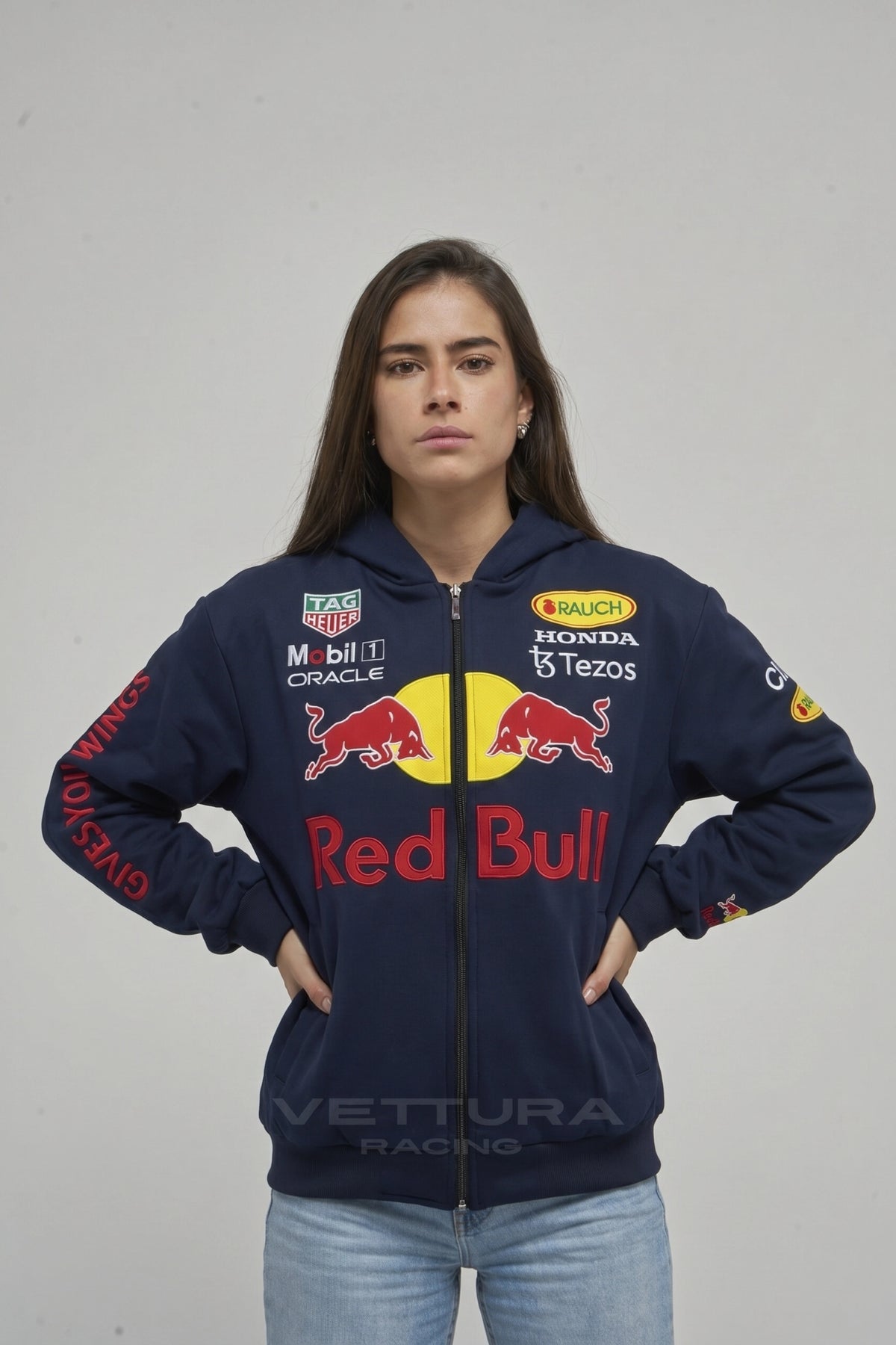 Model wearing the Red Bull Racing embroidered zip hoodie in navy, front view