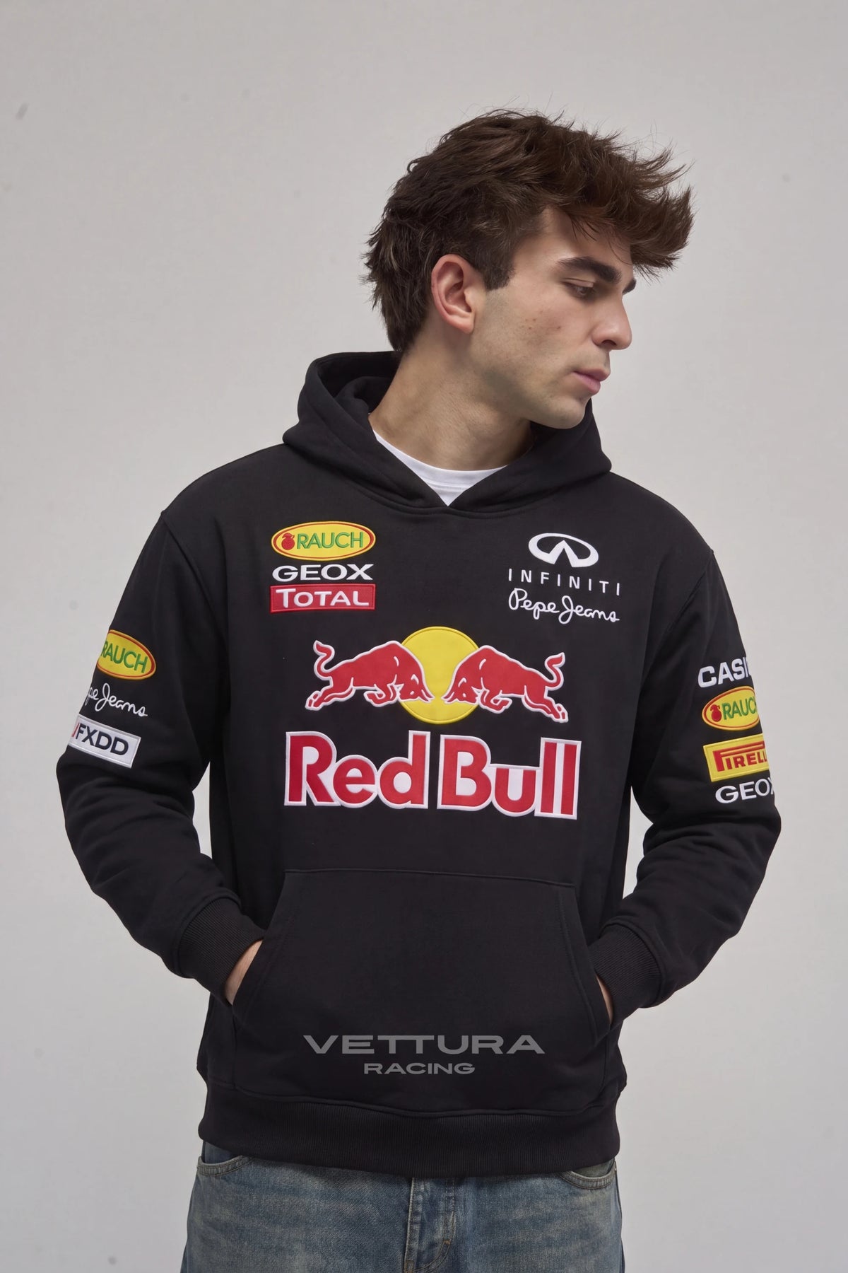 Man wearing the Red Bull Racing F1 hoodie in black, front view with the embroidered charging bulls