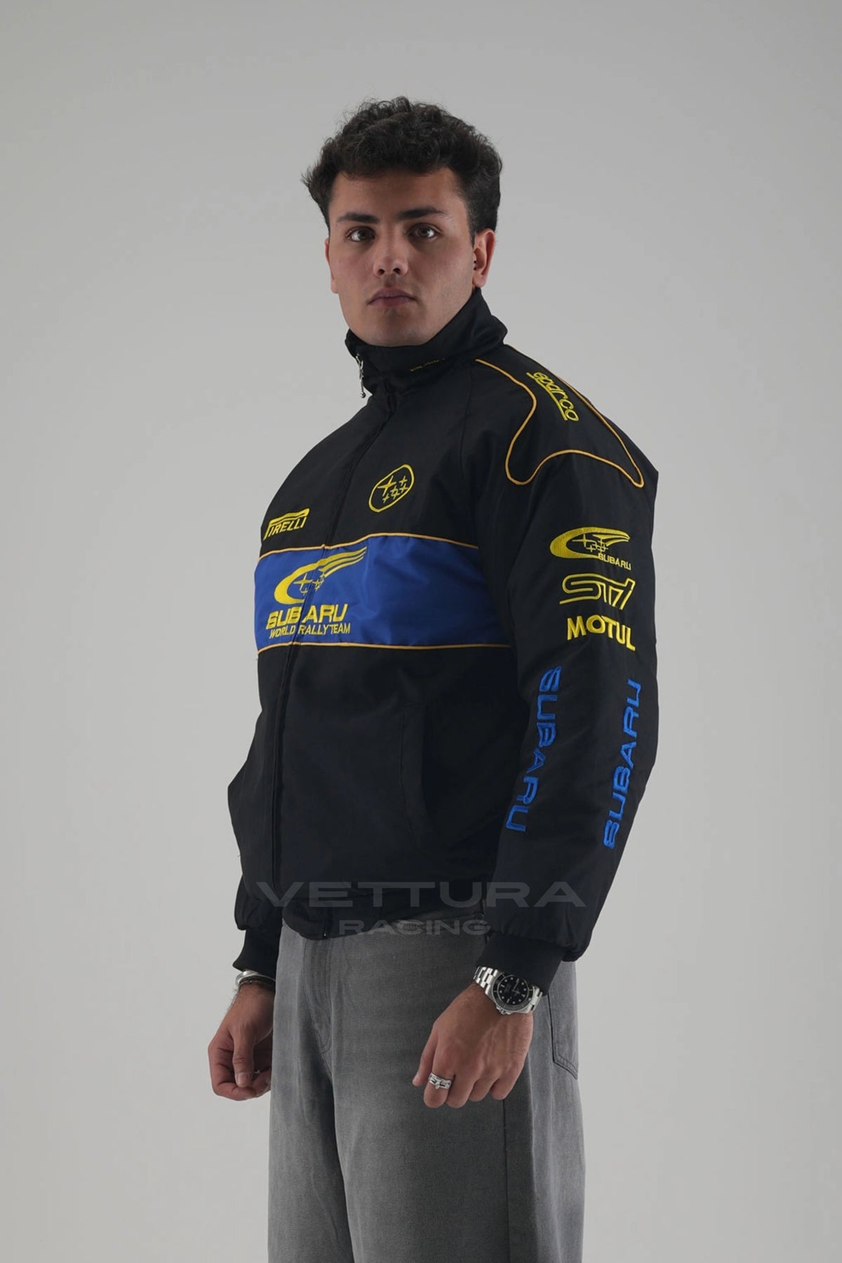 Side view of the black Subaru rally vintage racing jacket on a model