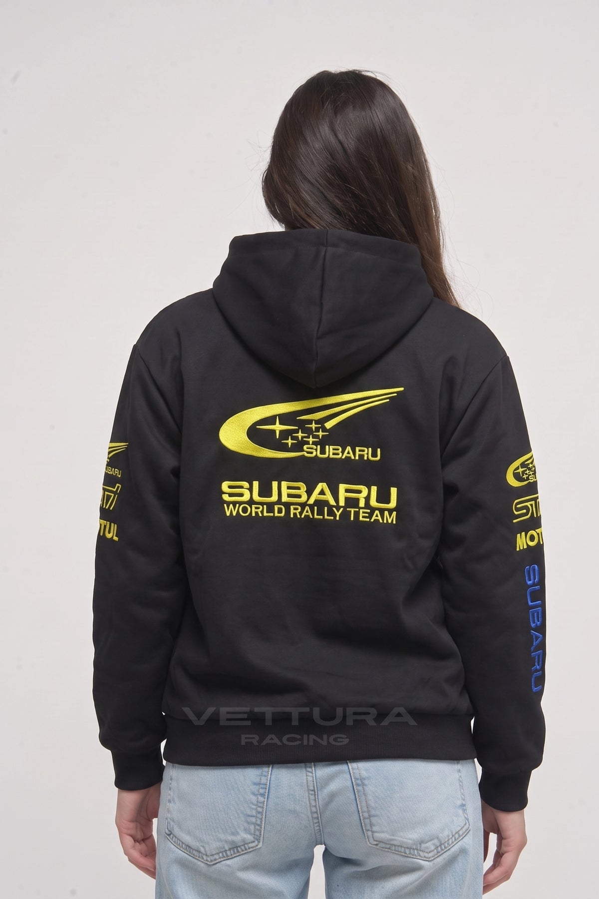 Model wearing the Subaru World Rally Team embroidered hoodie in black, front view