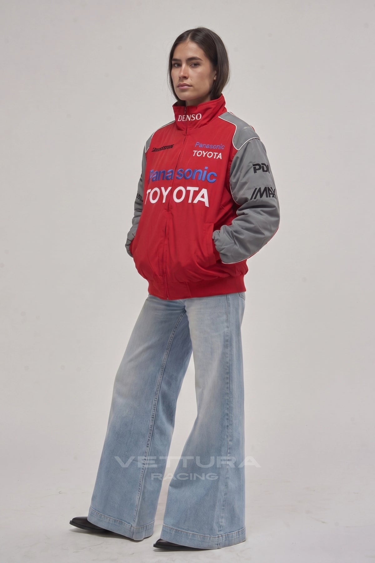 Toyota red racing jacket on a model, showing the grey shoulder panels