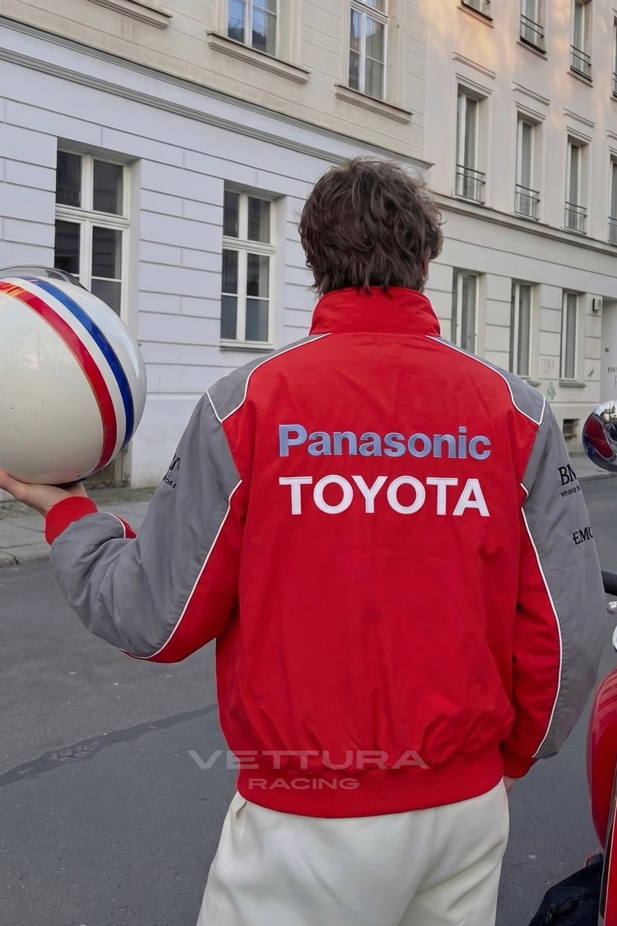 Detail of the padded shell and ribbed cuffs on the Toyota red jacket