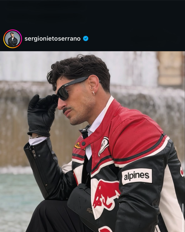 Man in sunglasses wearing a red and black Red Bull Alpinestars vintage racing jacket