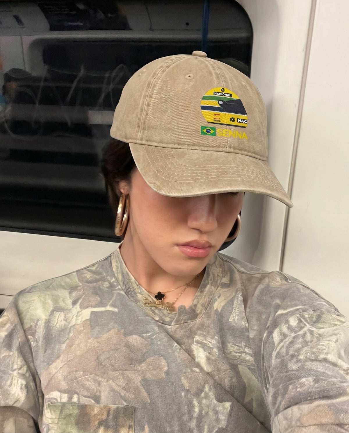 Beige Senna F1 cap worn on the street