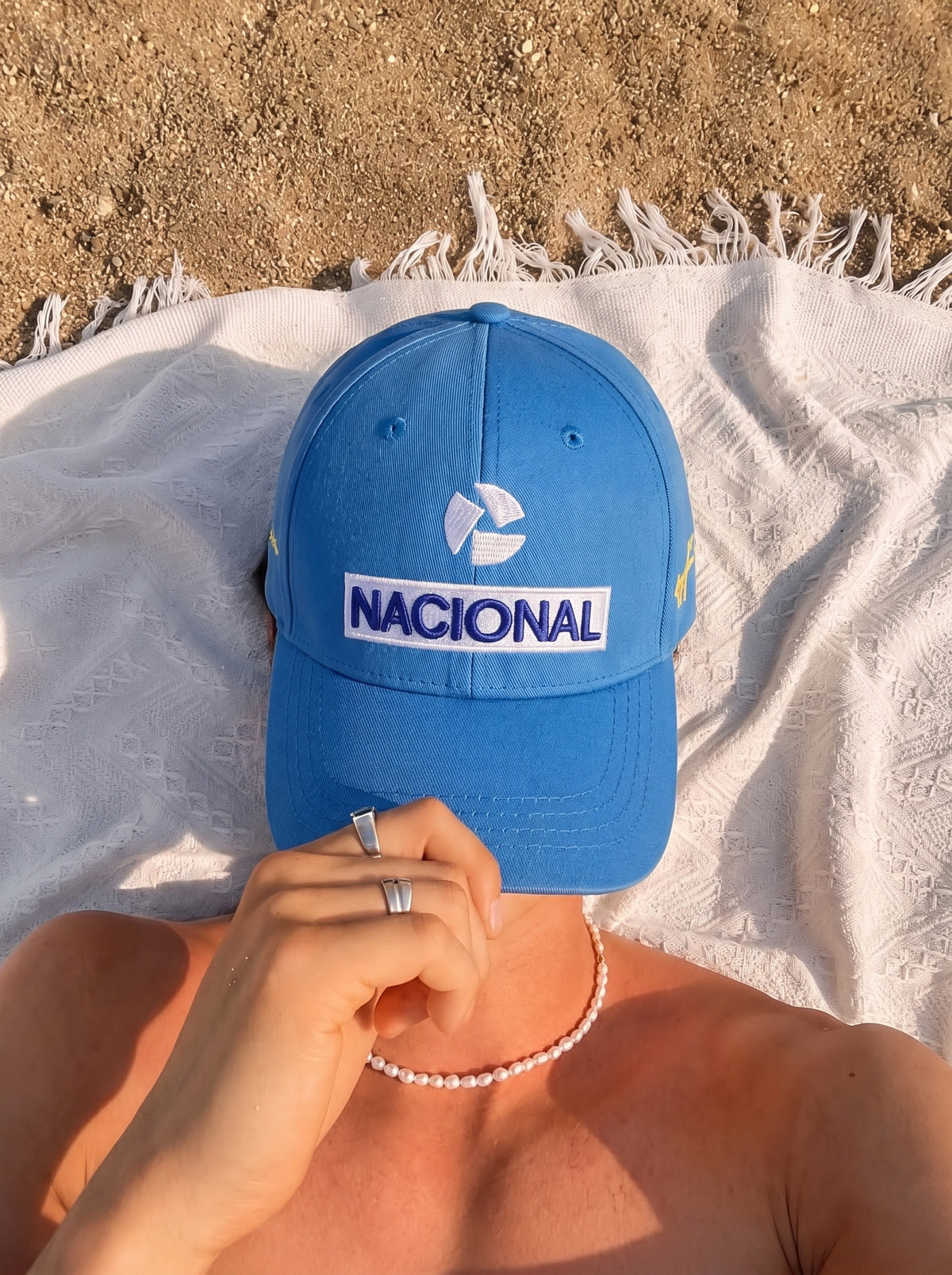 Blue Senna Nacional cap worn in the sun