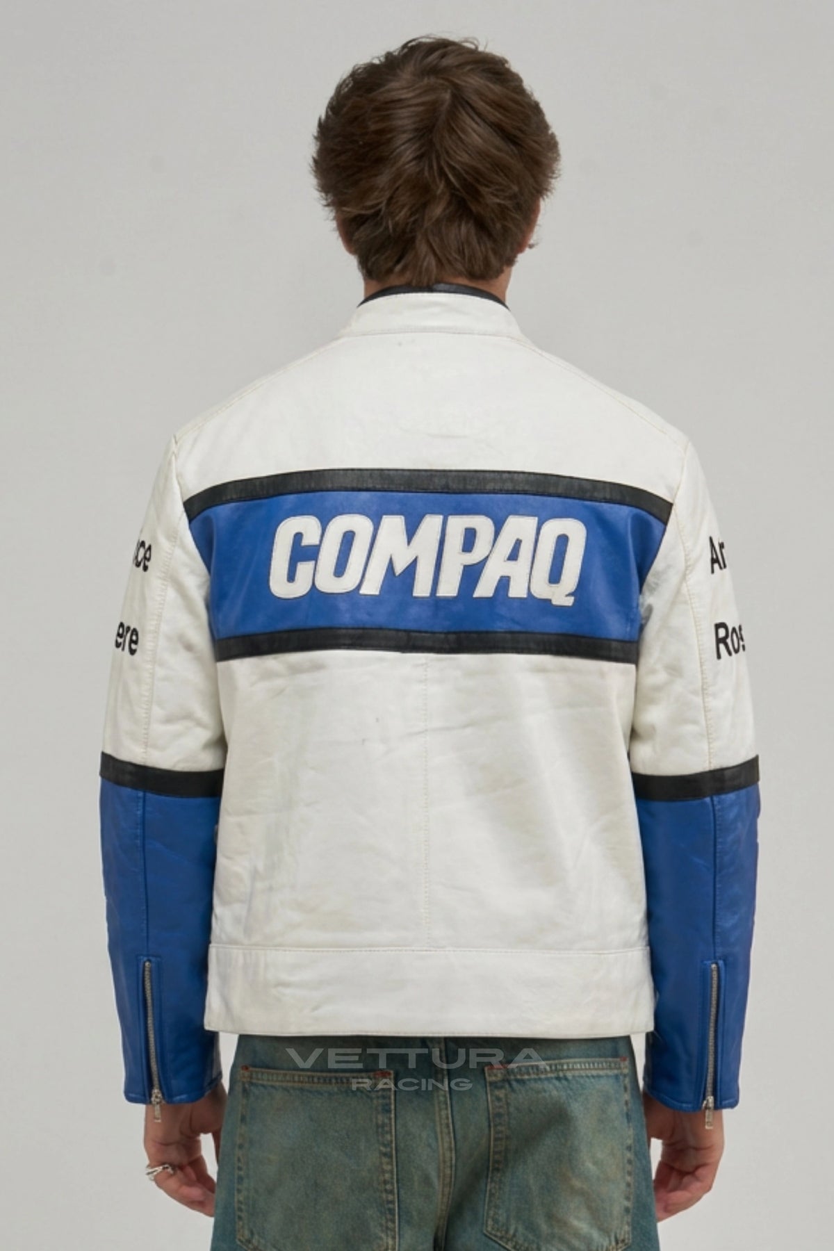 Close view of the Compaq chest block and BMW roundel on the leather jacket