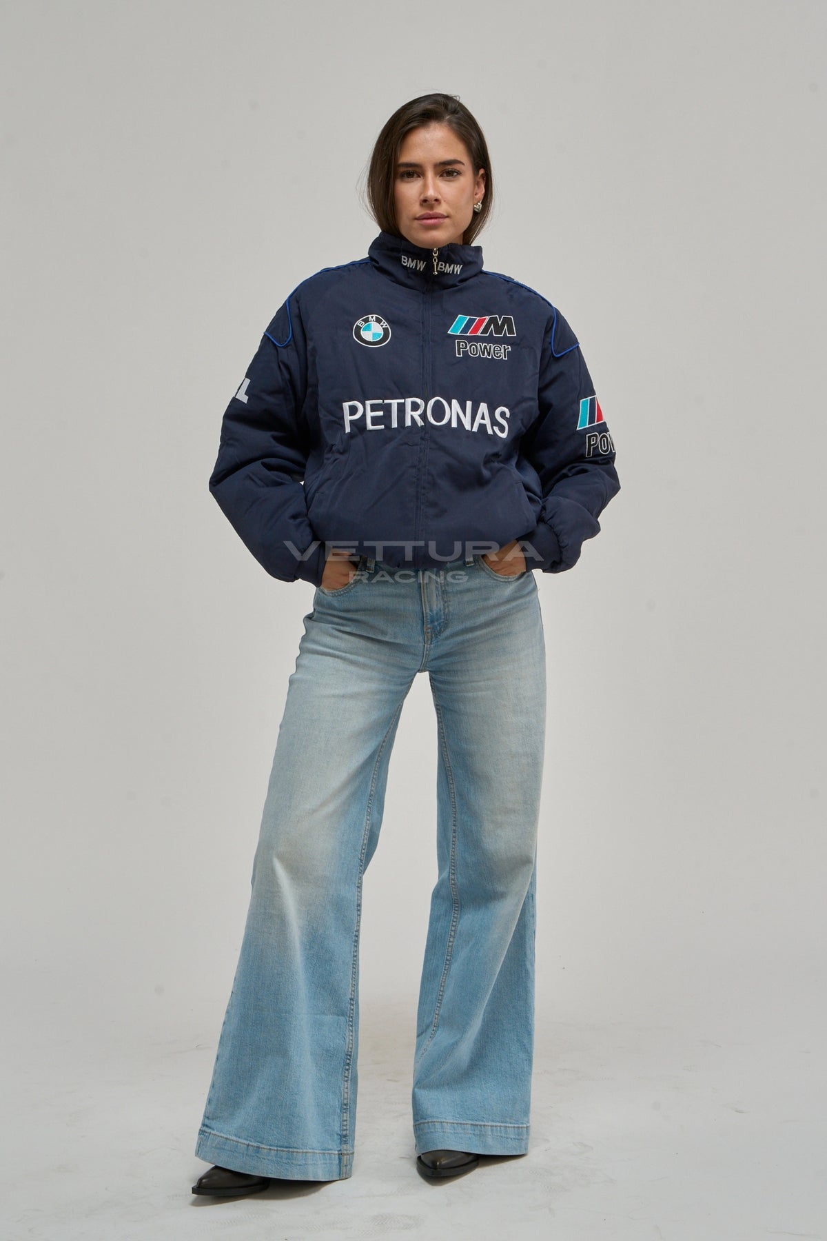 Woman wearing the navy BMW Petronas vintage F1 racing jacket