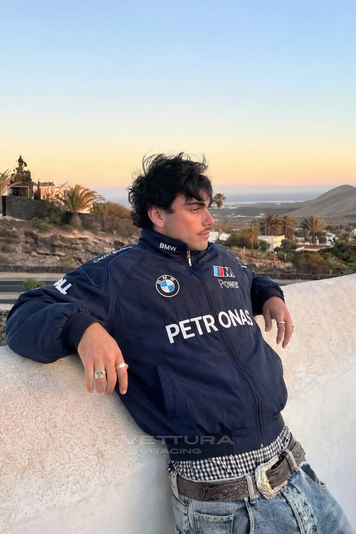 Outdoor lifestyle shot of the BMW Petronas vintage F1 racing jacket