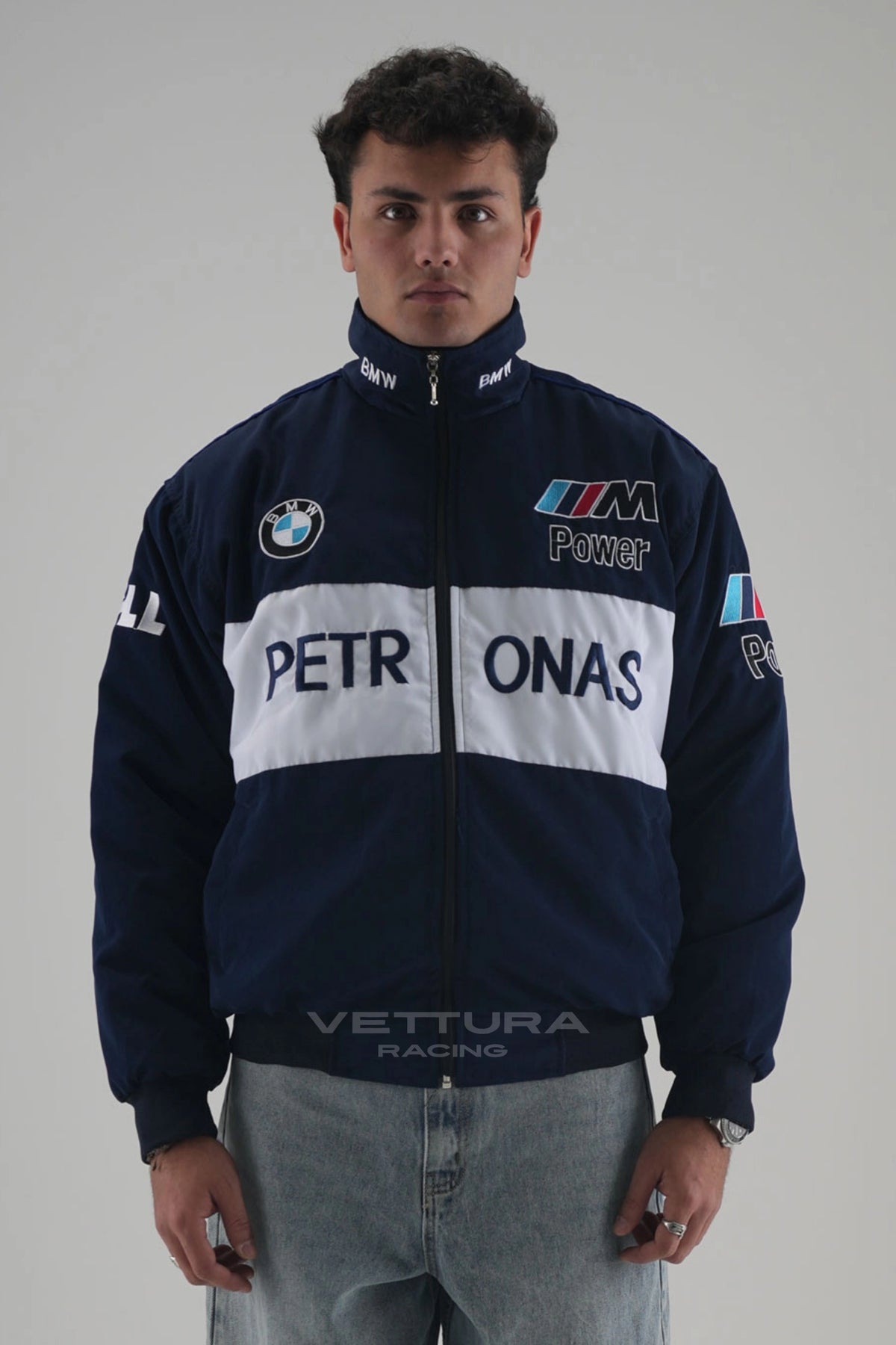 Model wearing the navy BMW M Power Petronas vintage racing jacket, front view