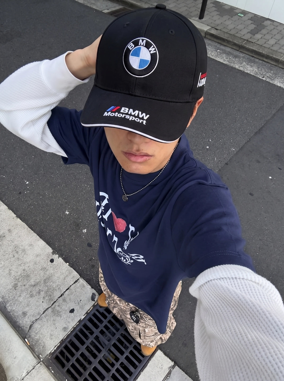 Model wearing the black BMW Motorsport cap