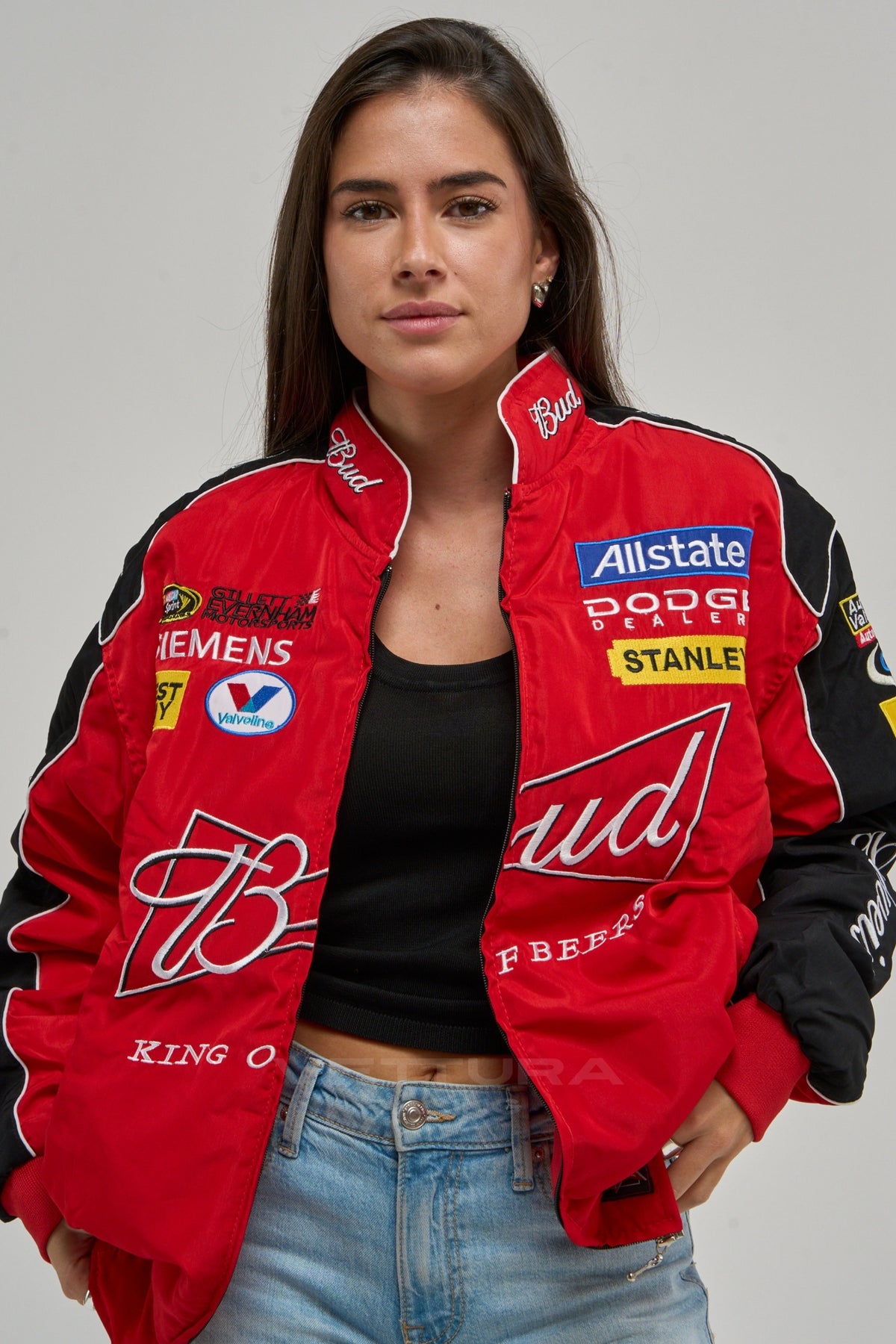 Woman wearing the red and black Budweiser NASCAR vintage racing jacket