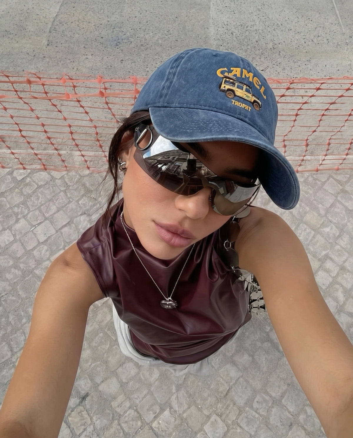 Model wearing the navy Camel 4x4 cap with sunglasses