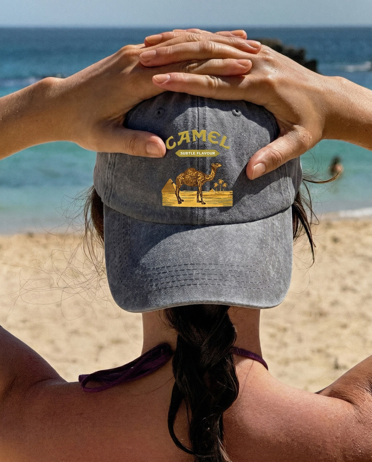 Camel Desert cap worn at the beach