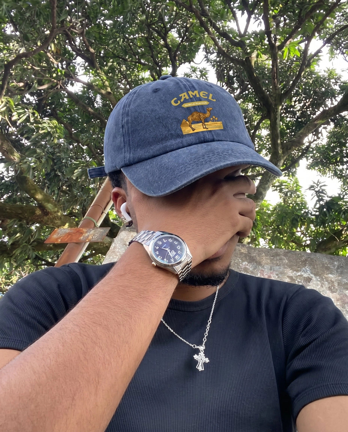 Navy Camel Desert cap worn outdoors