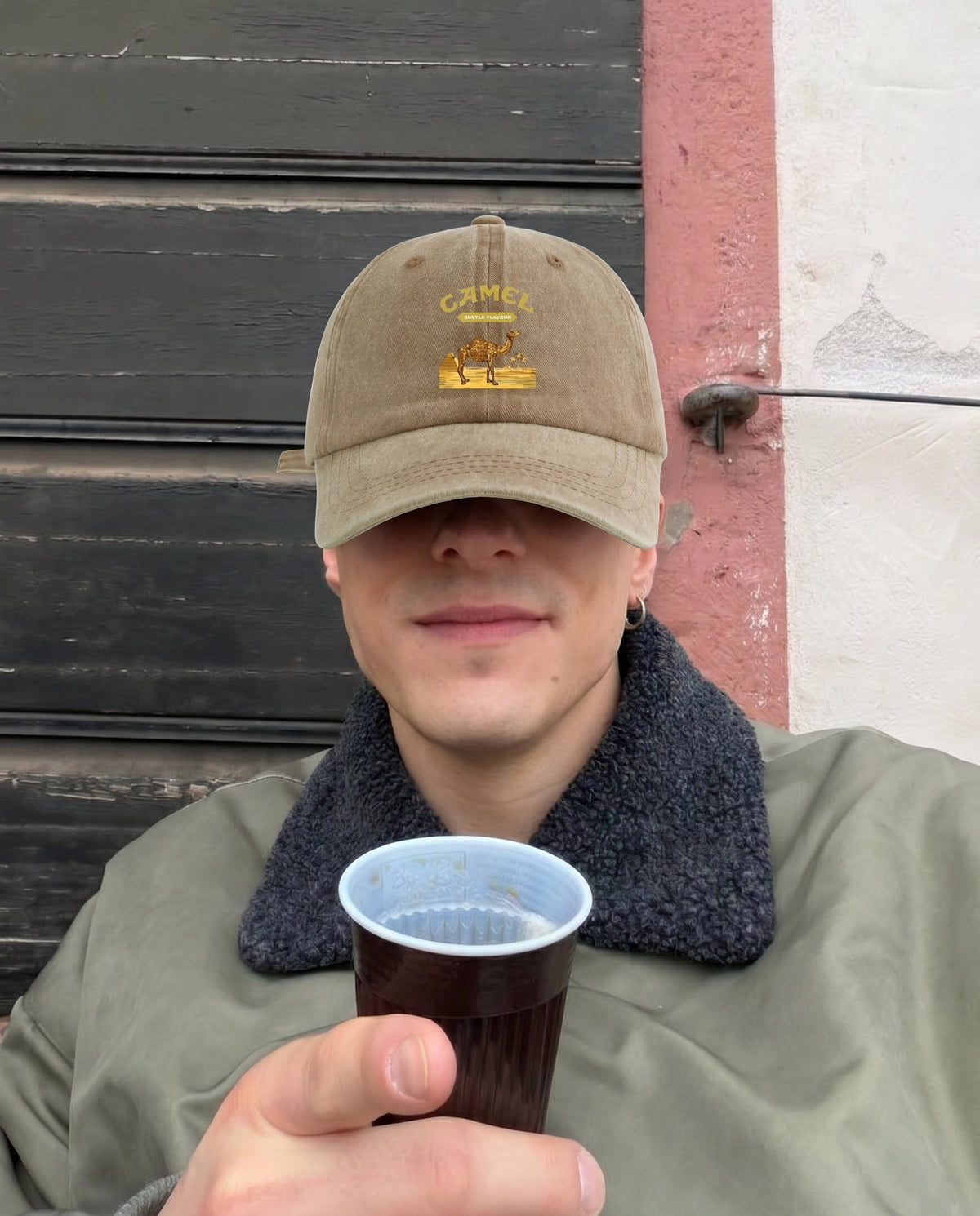 Sahara brown Camel Desert cap worn with a green jacket