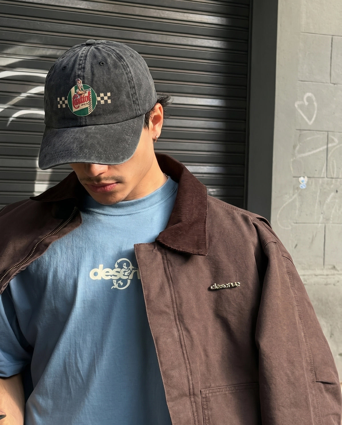 Model wearing the navy Castrol Motor cap