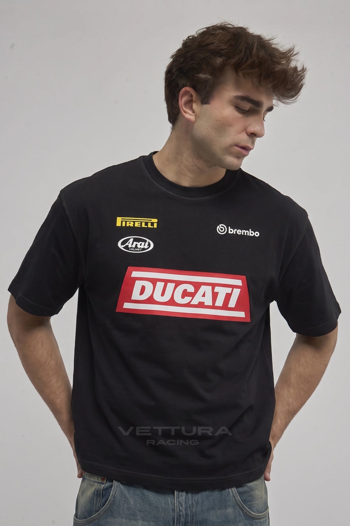 Man wearing the Ducati racing t-shirt in black, front view with the red Ducati chest block